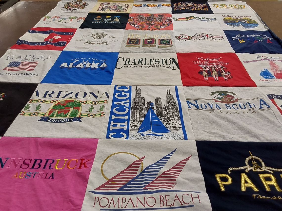T-shirt quilt with travel, geography themes by Cindye from MO