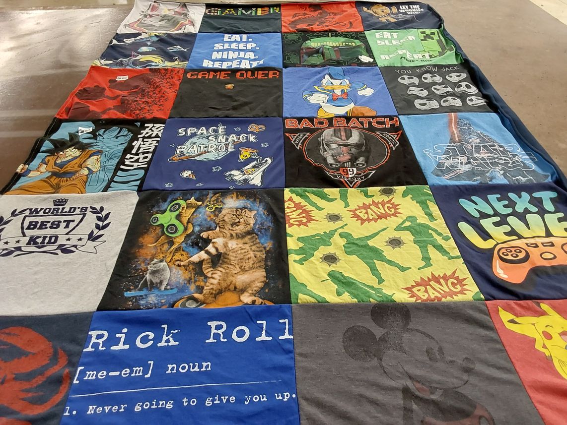 T-shirt quilt with gaming, cartoons themes by Lynne from MA