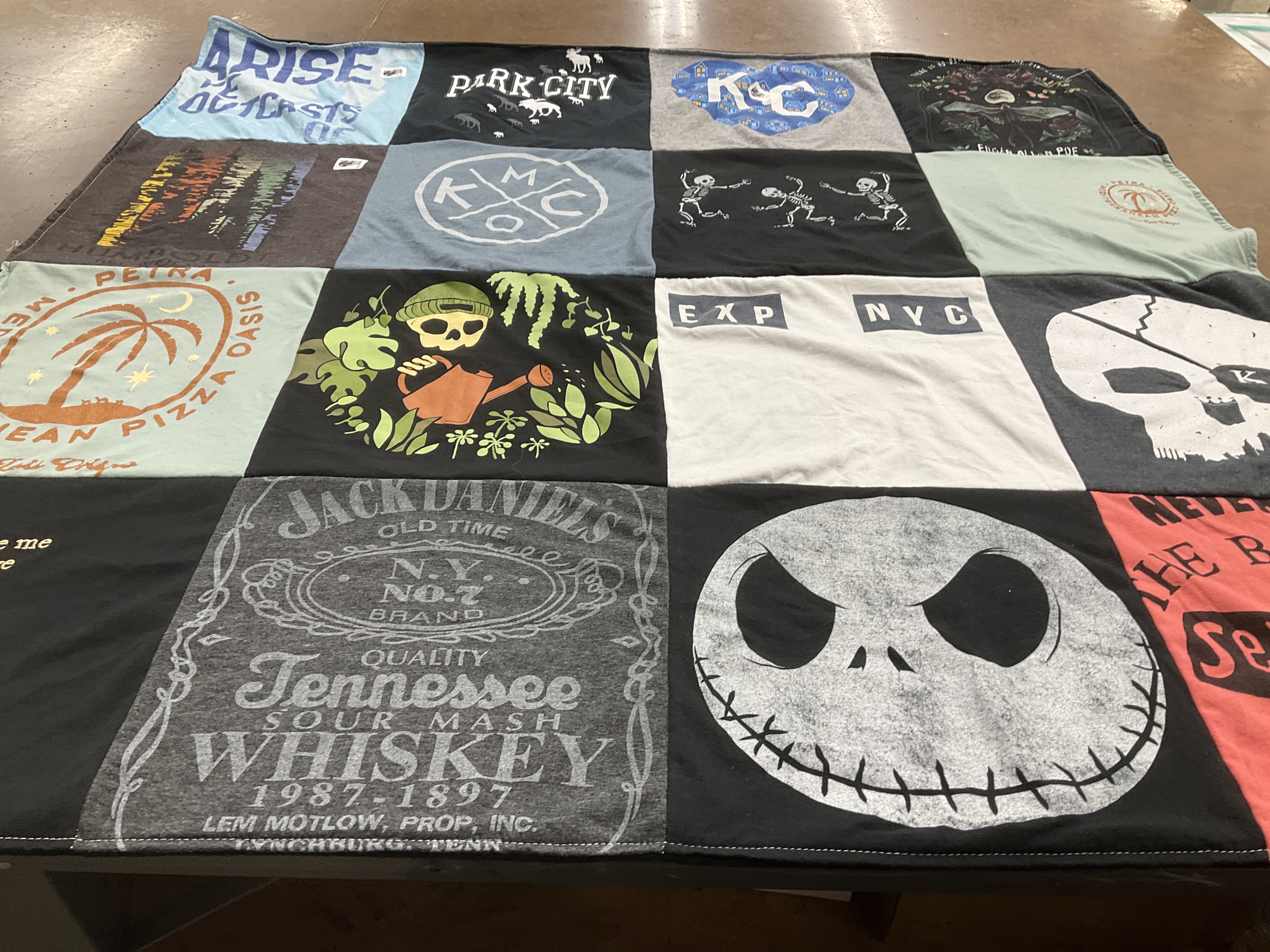 T-shirt quilt with hiking, pizza themes by Melinda from KS