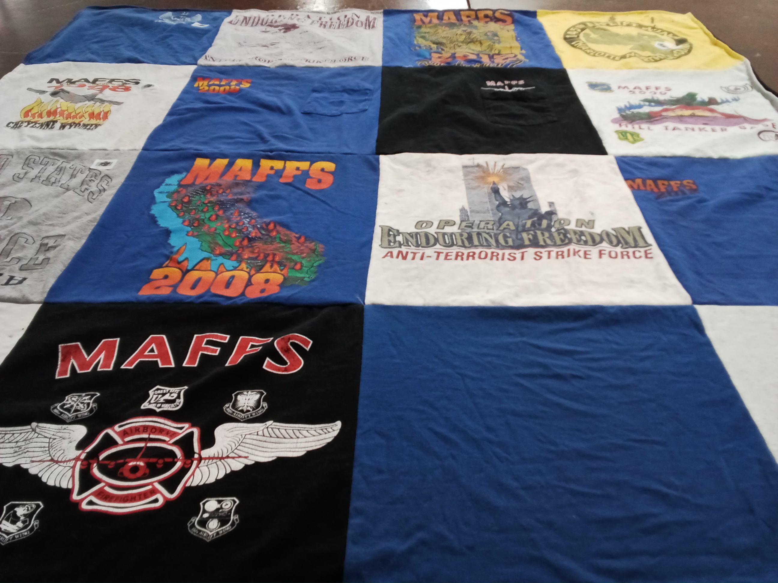 T-shirt quilt with firefighting, military themes by Pamela from NC
