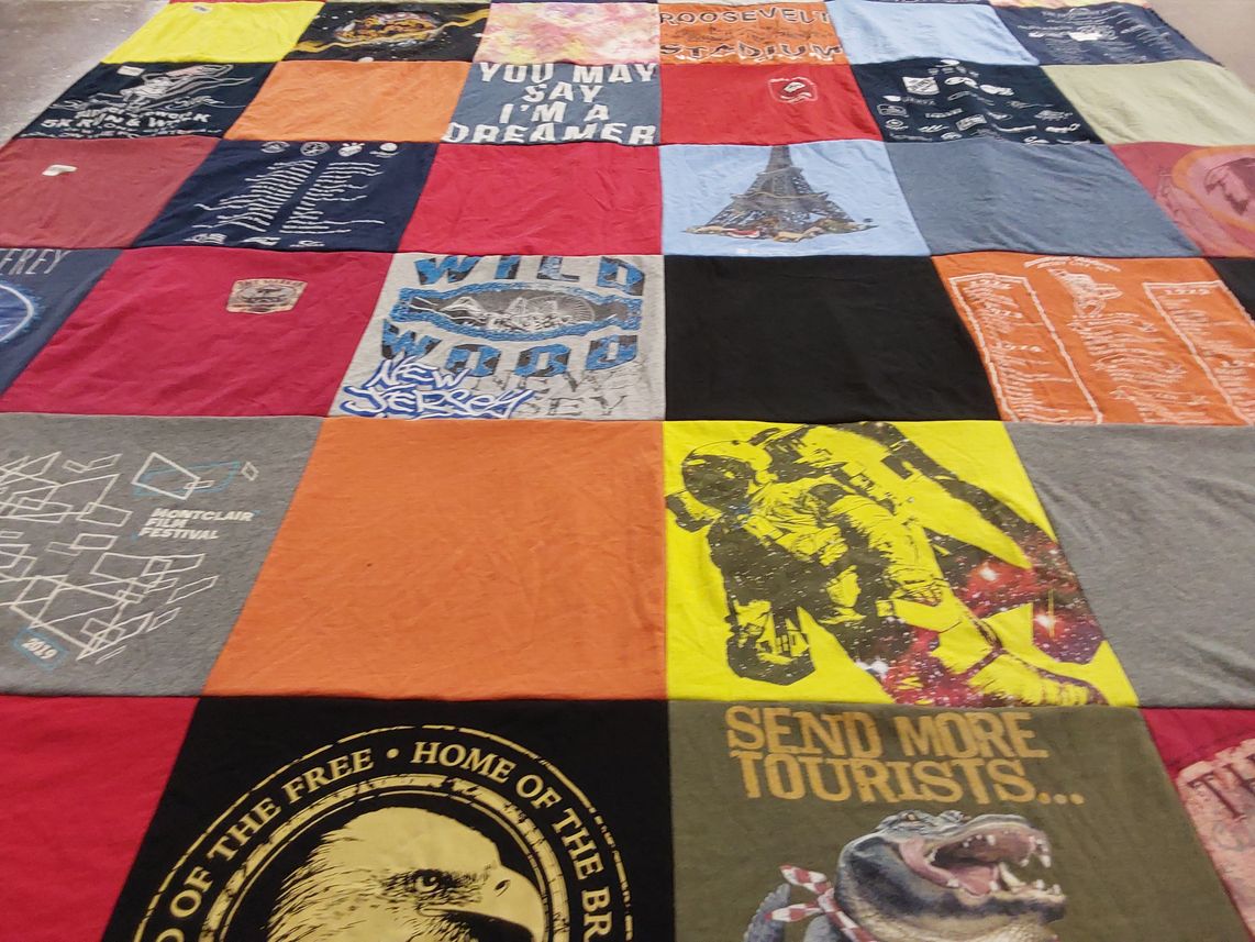 T-shirt quilt with cinema, travel themes by Patrice from NJ