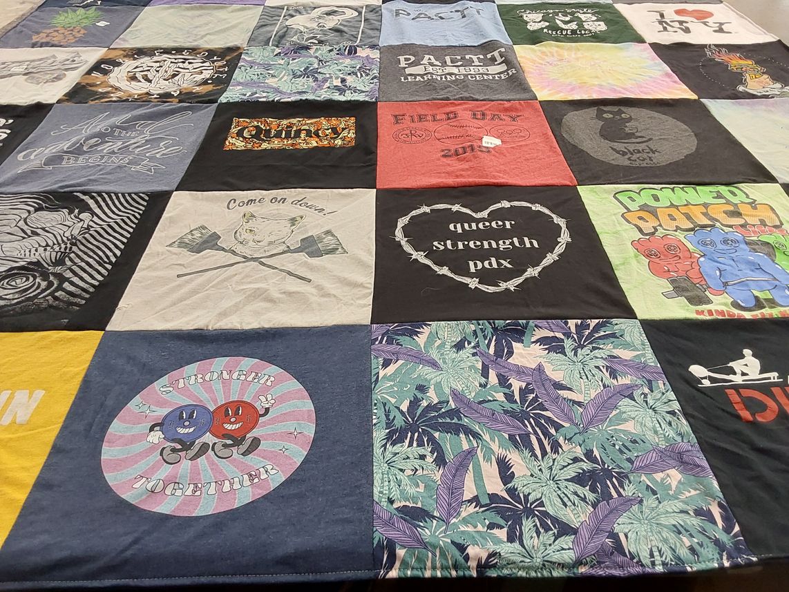 T-shirt quilt with community, strength themes by Shannon from IL