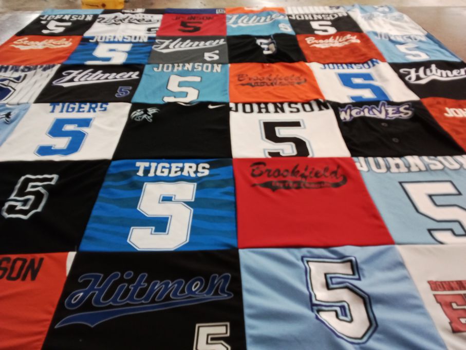 T-shirt quilt with sports themes by Carrie from IL