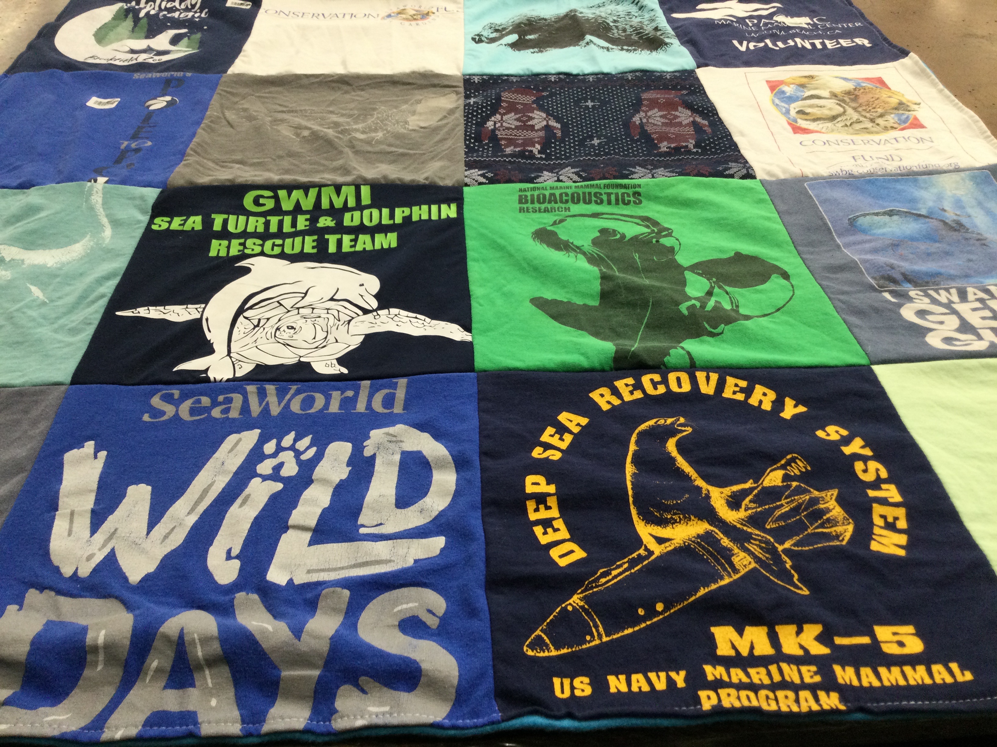 T-shirt quilt with marine life, conservation themes by Elaine from AZ