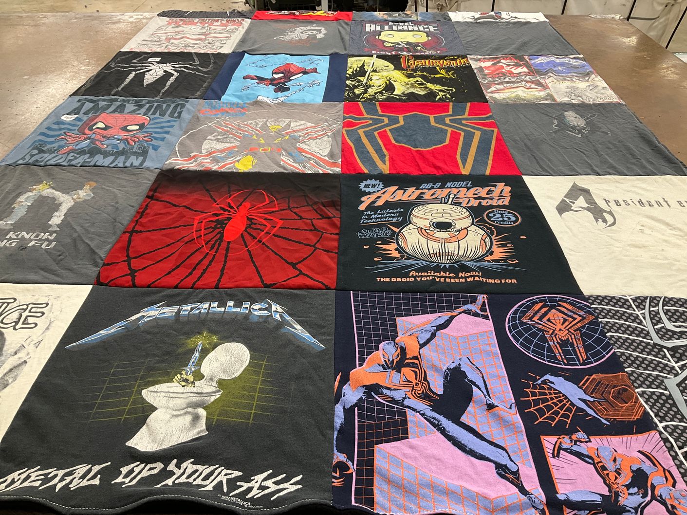 T-shirt quilt with comic books, music themes by Ruth from TX