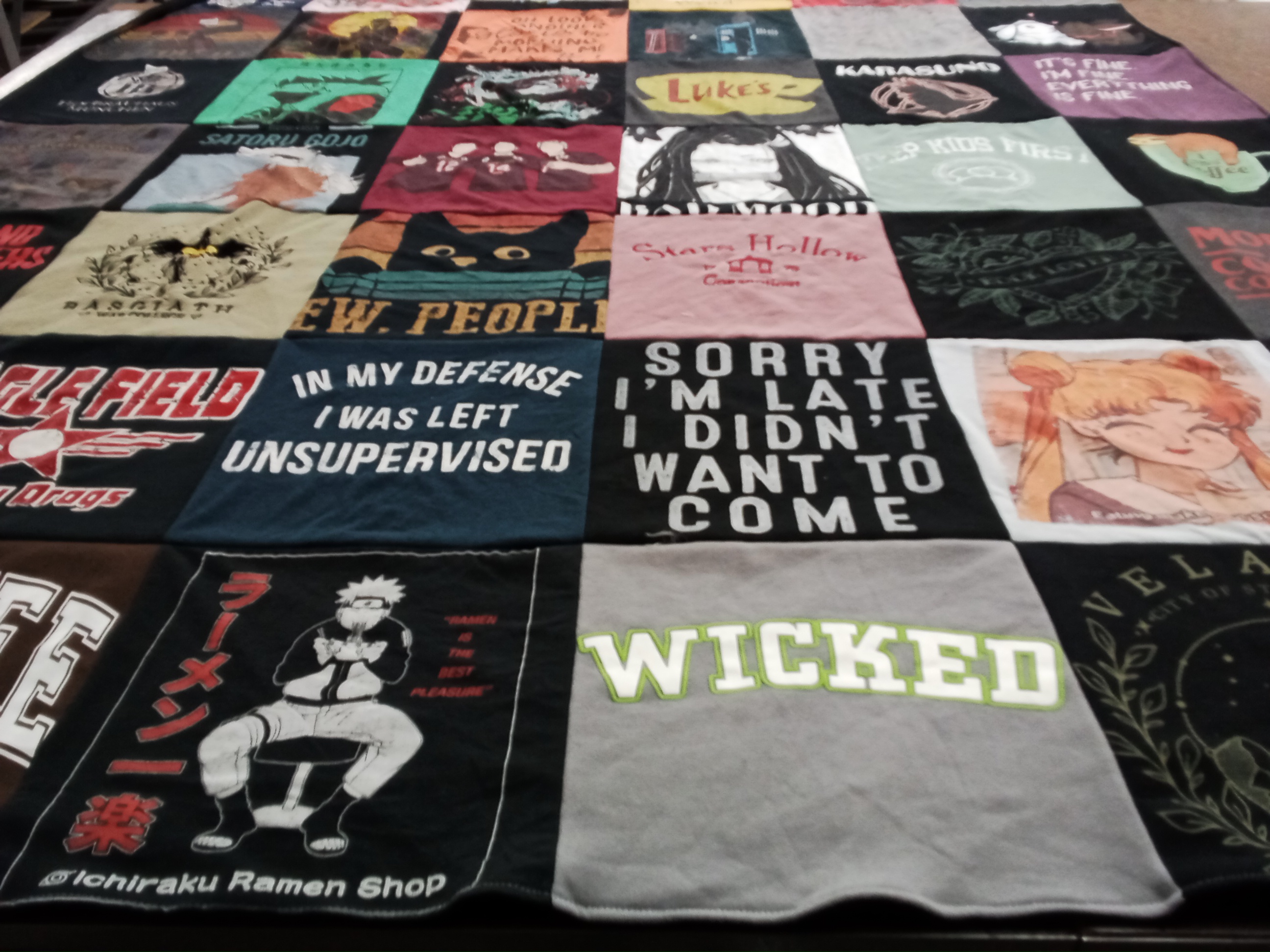 T-shirt quilt with anime, pop culture themes by Megan from OR
