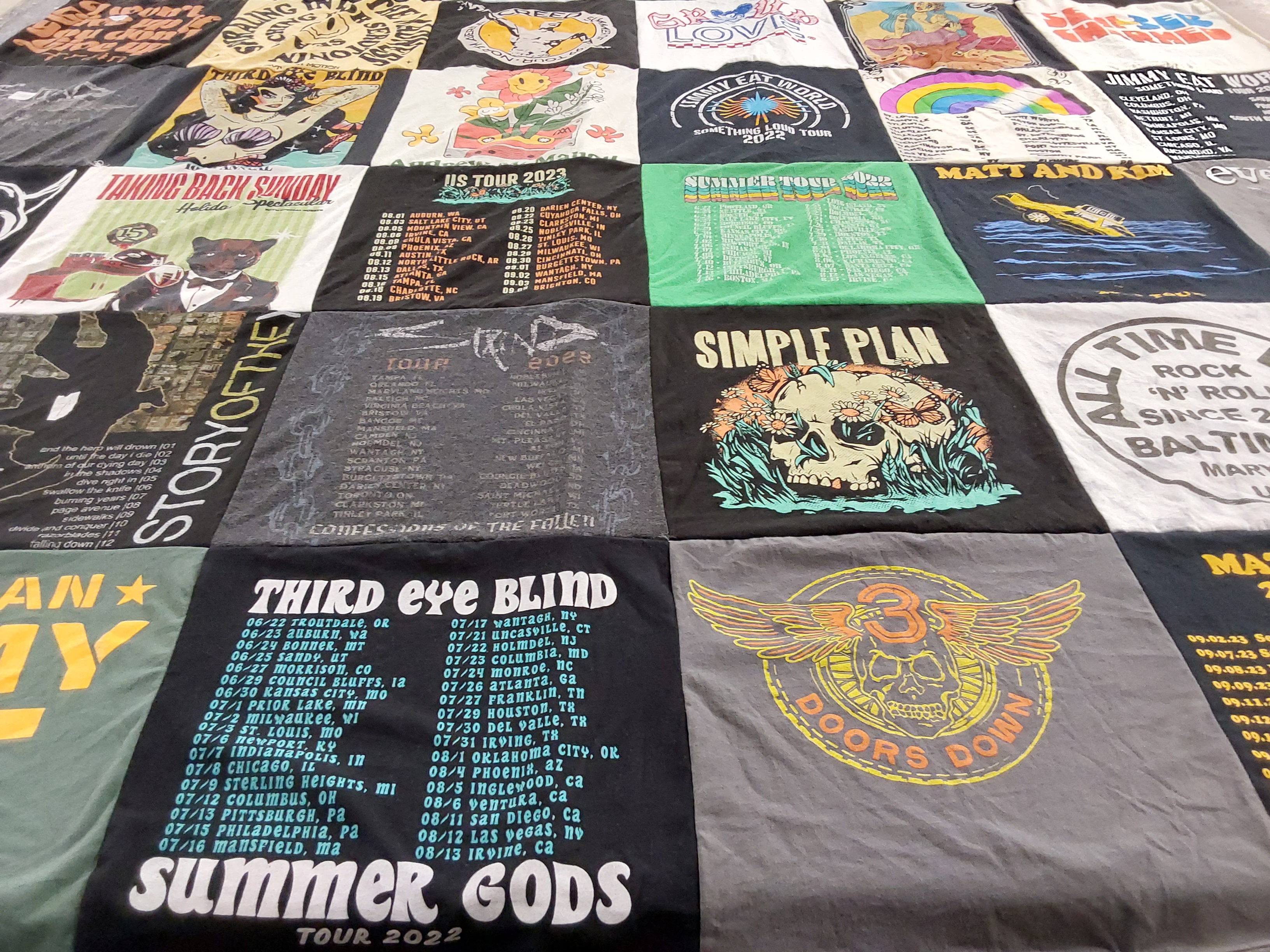 Custom Project Repat t-shirt quilt highlighting music, concerts themes.