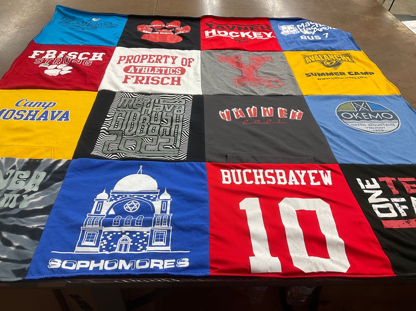 T-shirt quilt with sports, camping themes by Amy from NJ