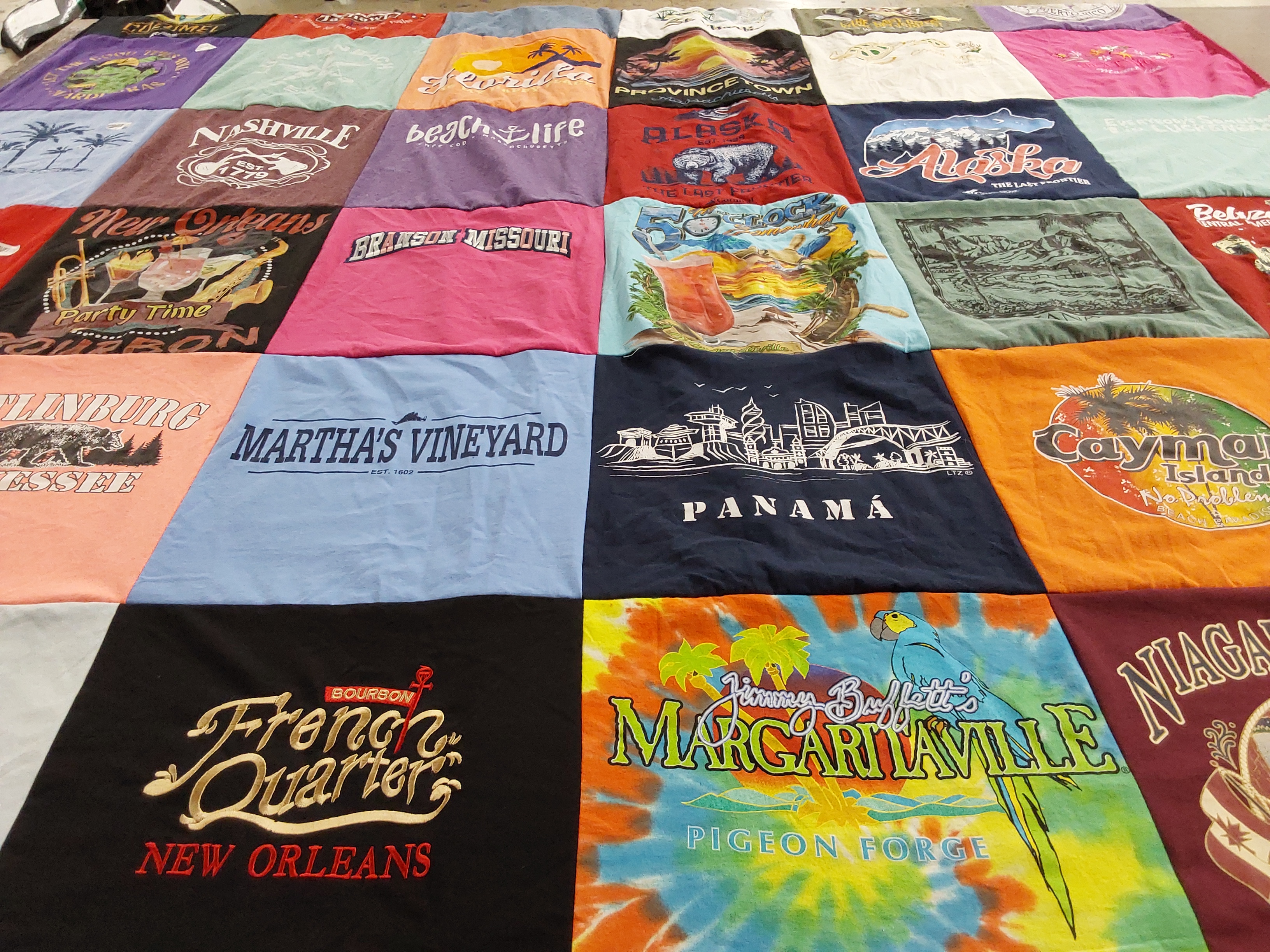 T-shirt quilt with travel, beaches themes by Joleen from KS