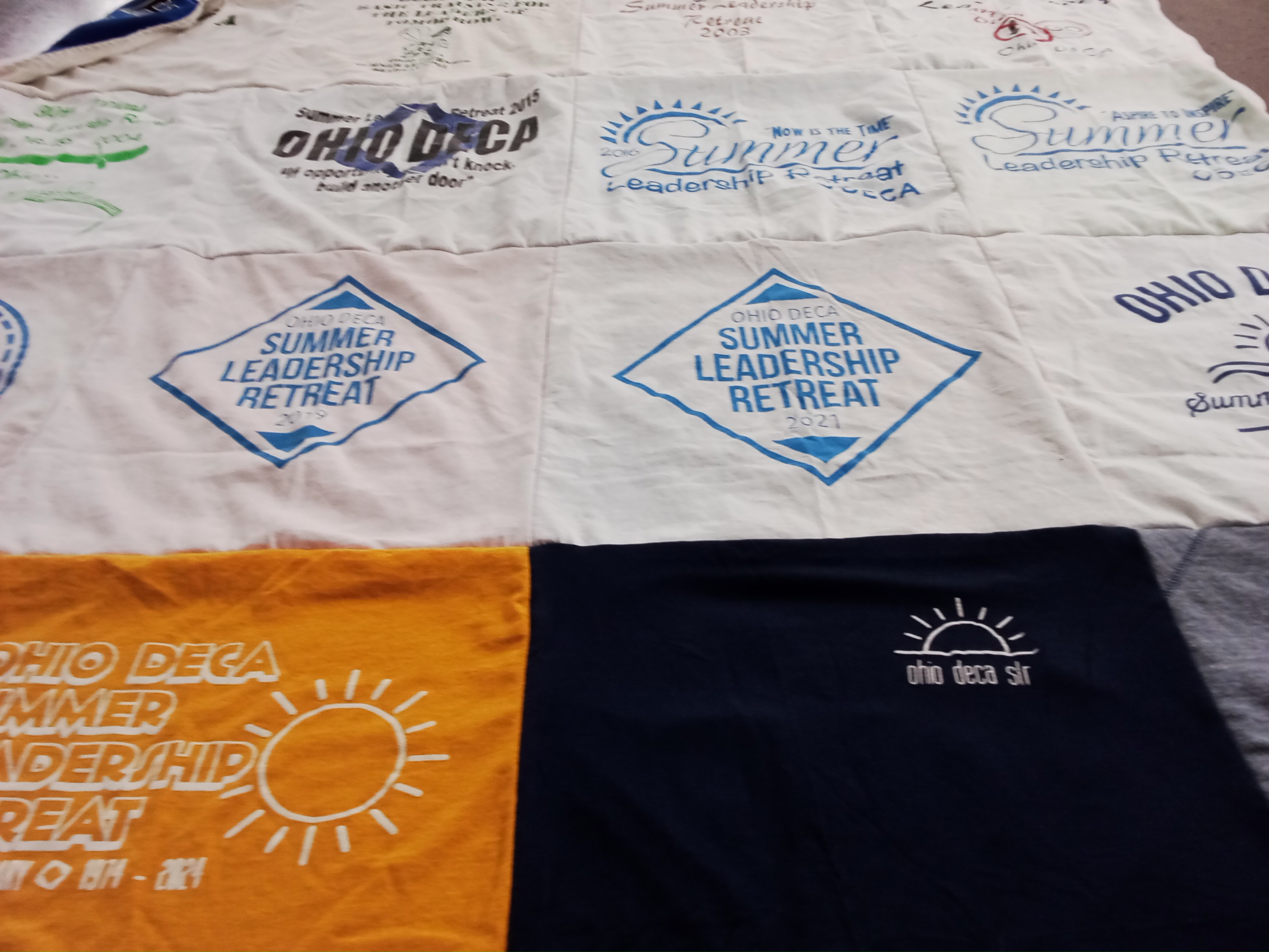 T-shirt quilt with leadership, business themes by Vallie from OH