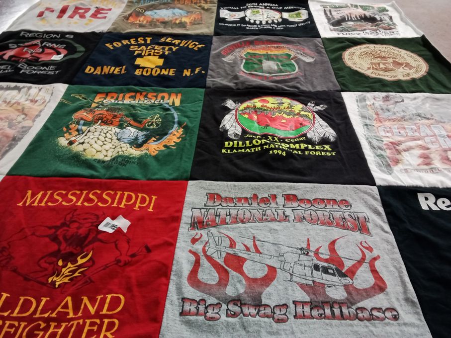 T-shirt quilt with firefighting, environmental conservation themes by Martha from KY