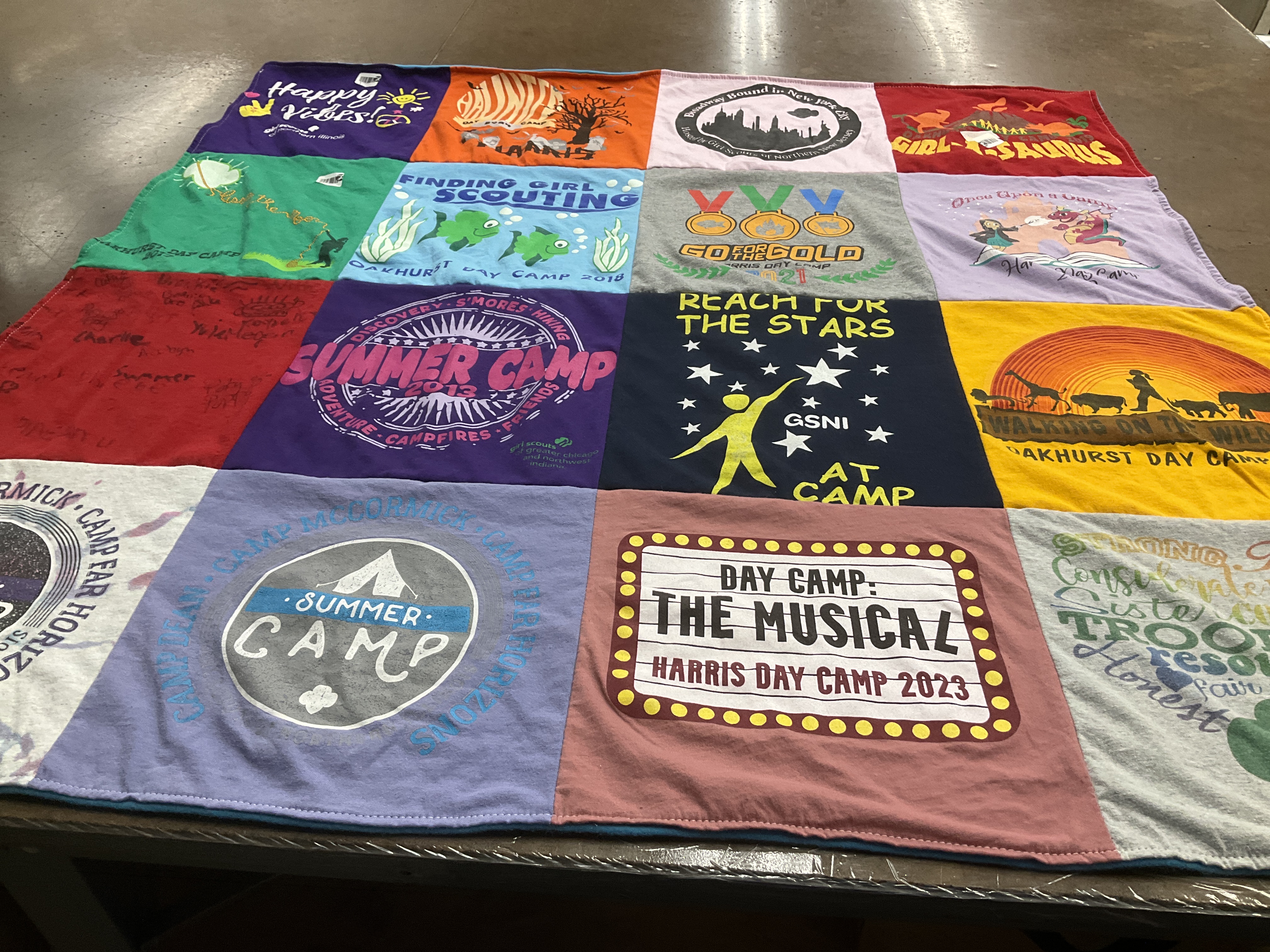 T-shirt quilt with camping, girl scouts themes by Jennifer from IL