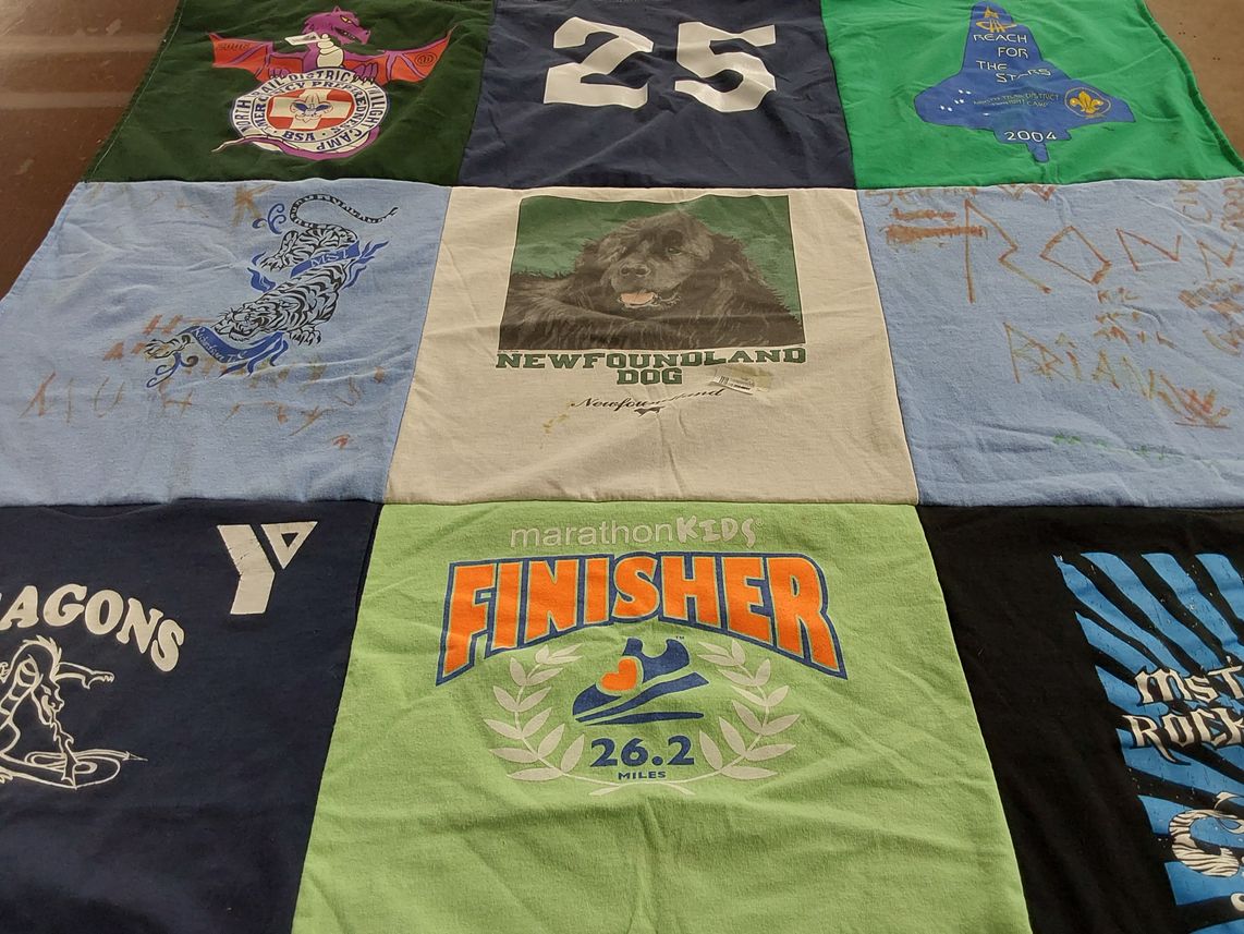 T-shirt quilt with sports, dogs themes by Kimberly from TX
