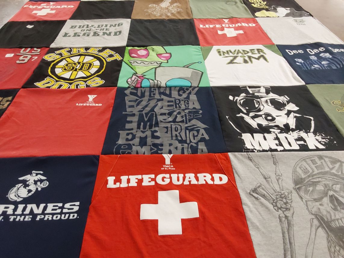 T-shirt quilt with swimming, saving lives themes by Dana from TX