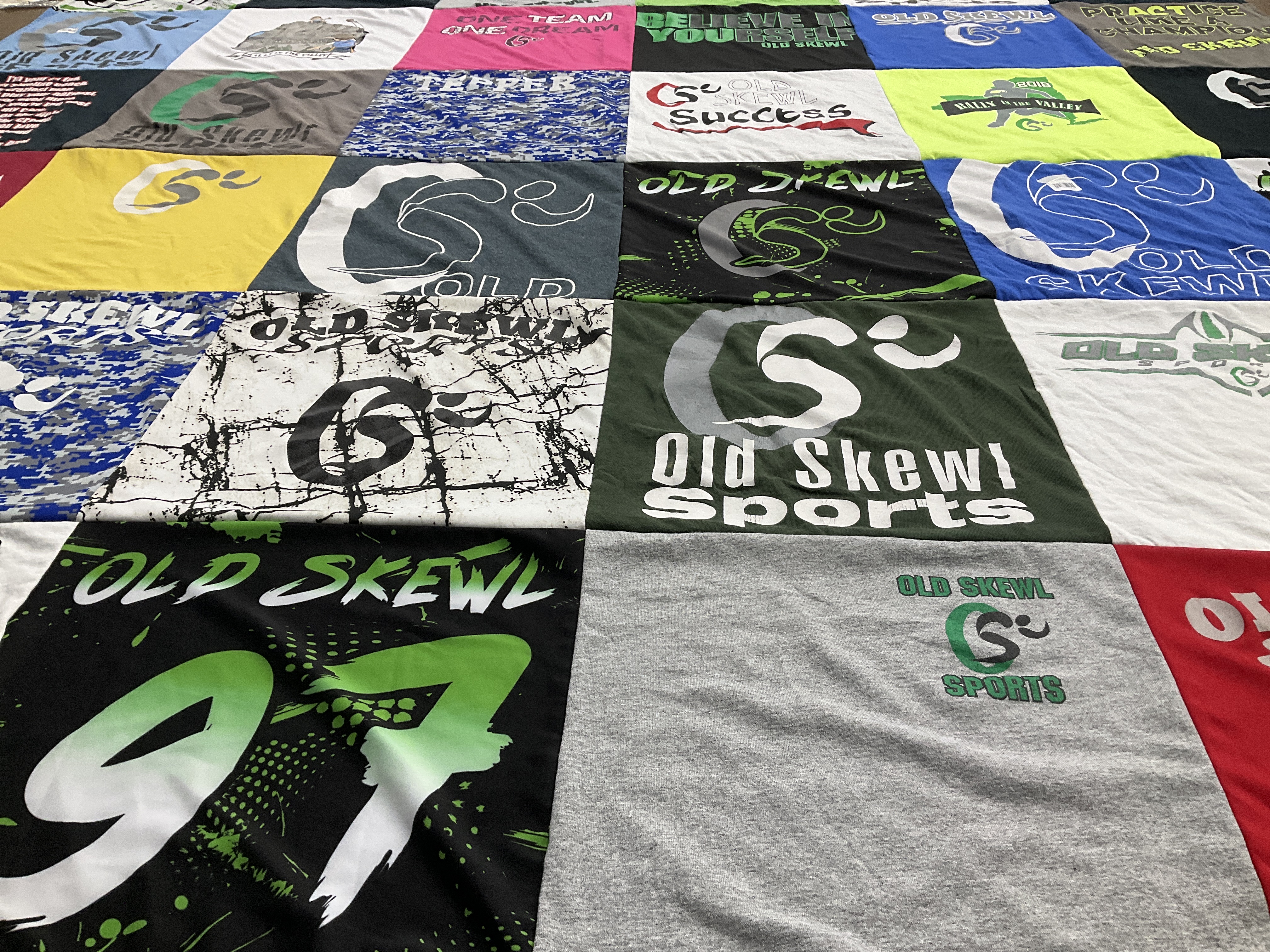 T-shirt quilt with sports, teamwork themes by Rachel from NY