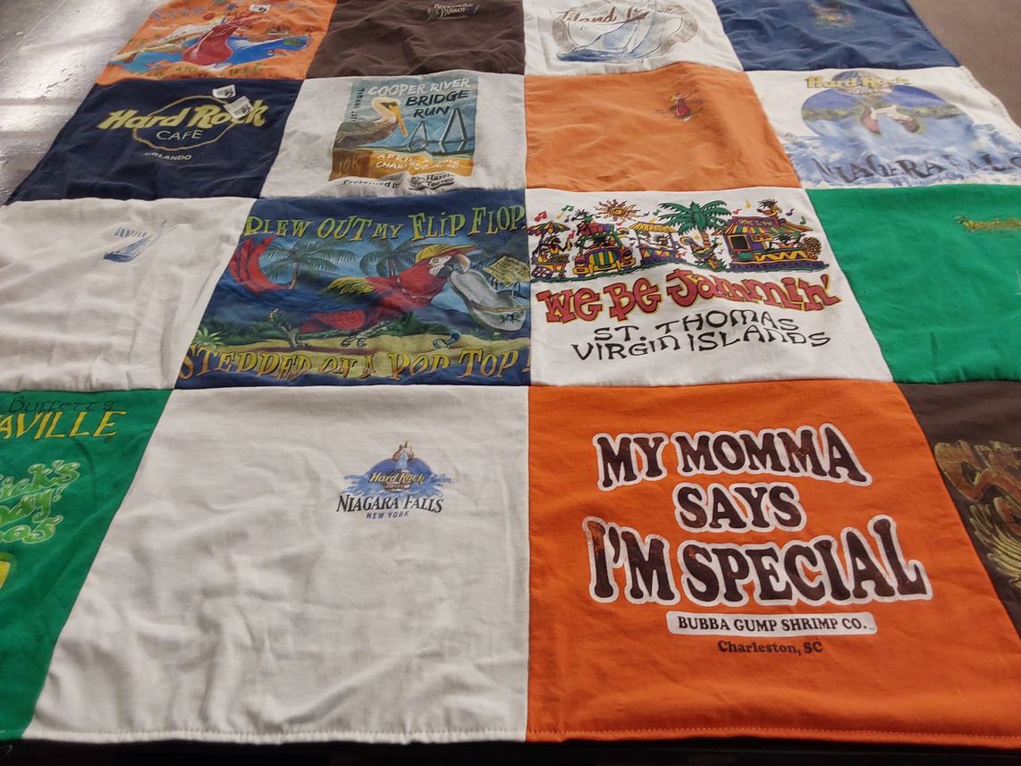 T-shirt quilt with hard rock, travel themes by Tina from NC