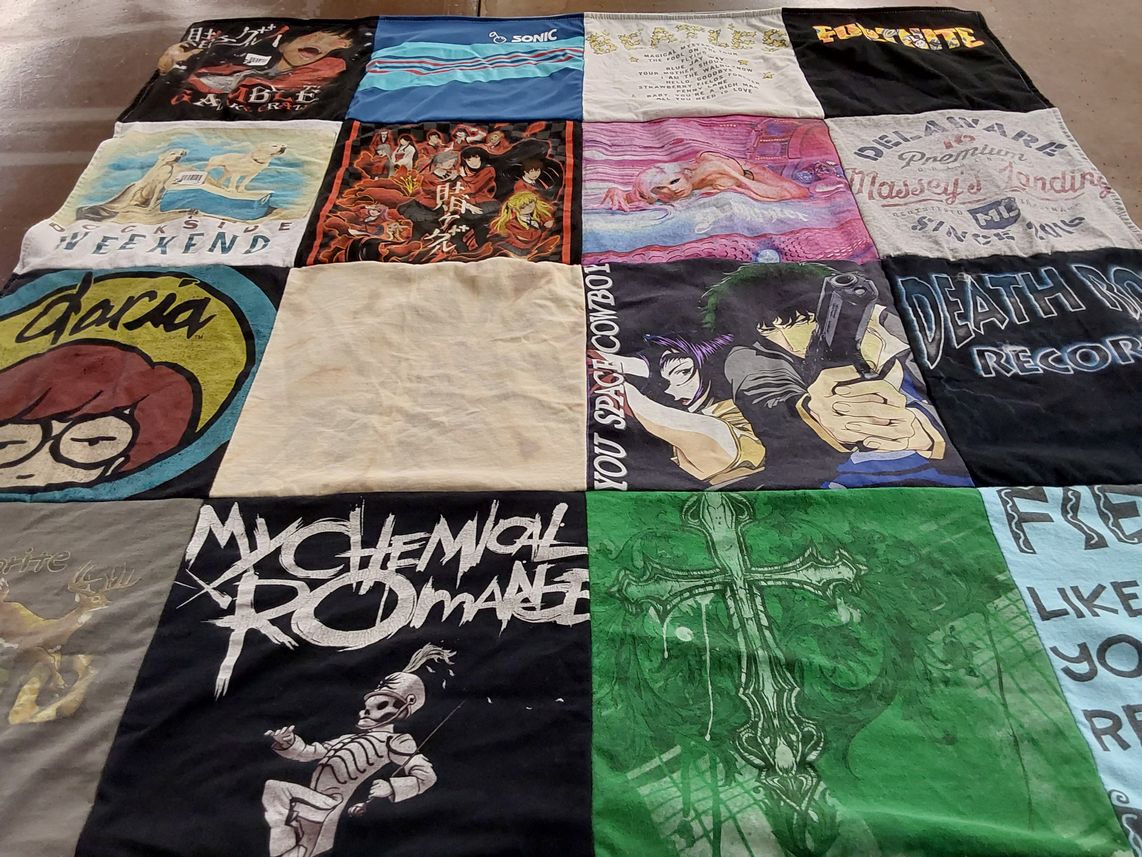 T-shirt quilt with anime, music themes by Erica from MS