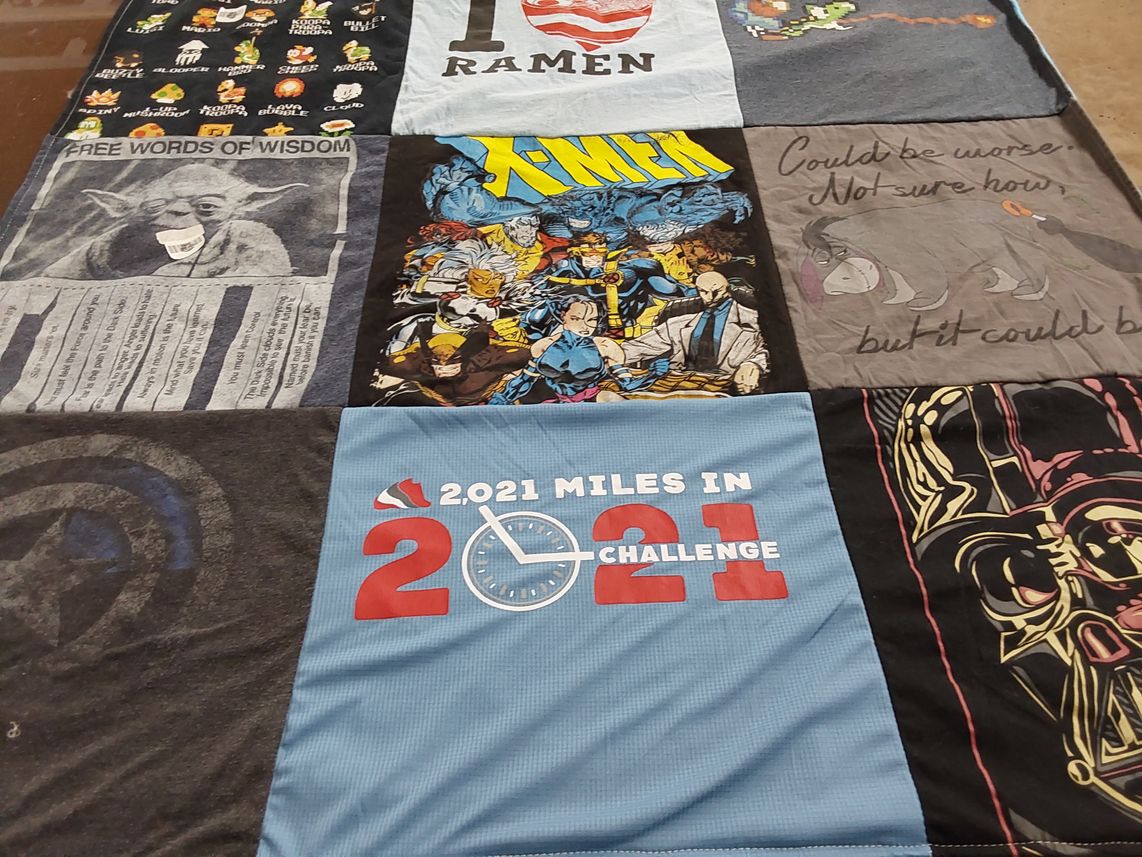 T-shirt quilt with comics, movies themes by Shea from OK