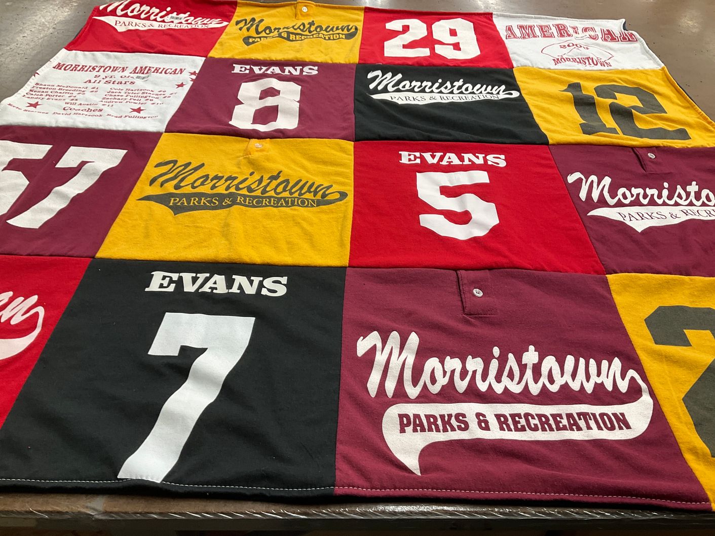 T-shirt quilt with sports, community activities themes by Angie from TN