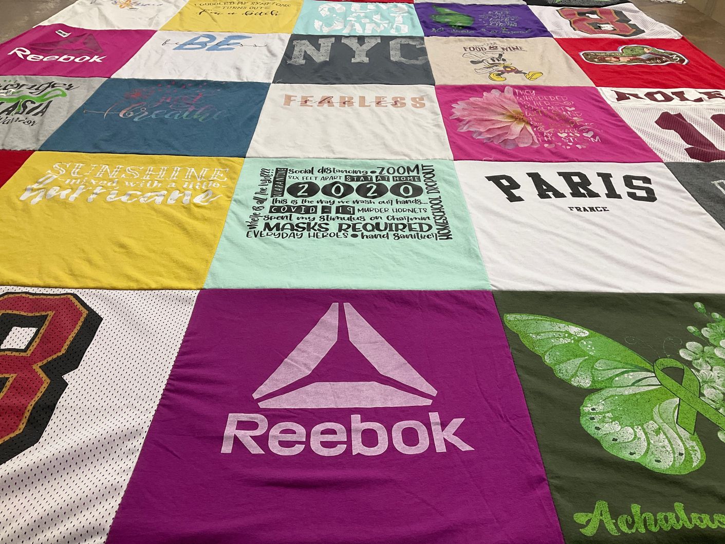 T-shirt quilt with travel, fitness themes by George from FL