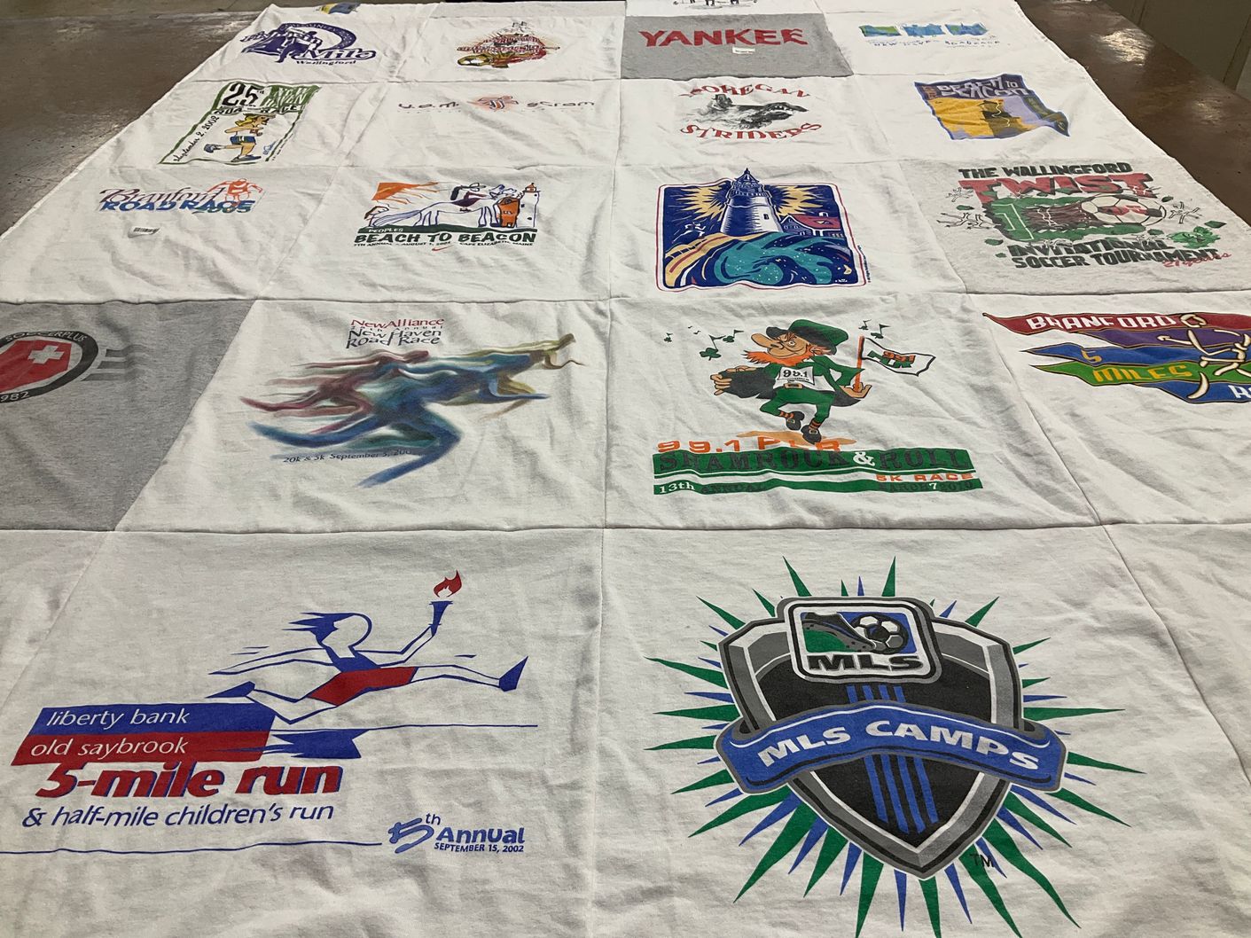T-shirt quilt with running, soccer themes by Cynara from CT