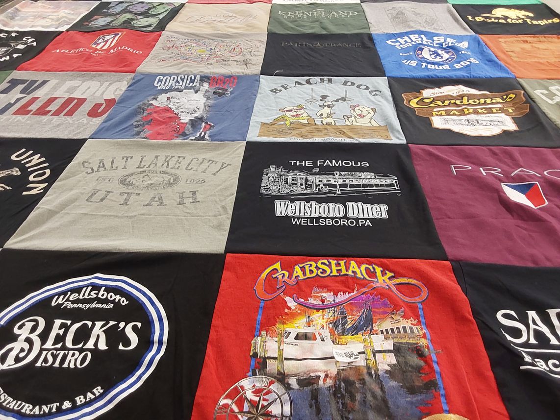 T-shirt quilt with food, travel themes by Glenna from NC