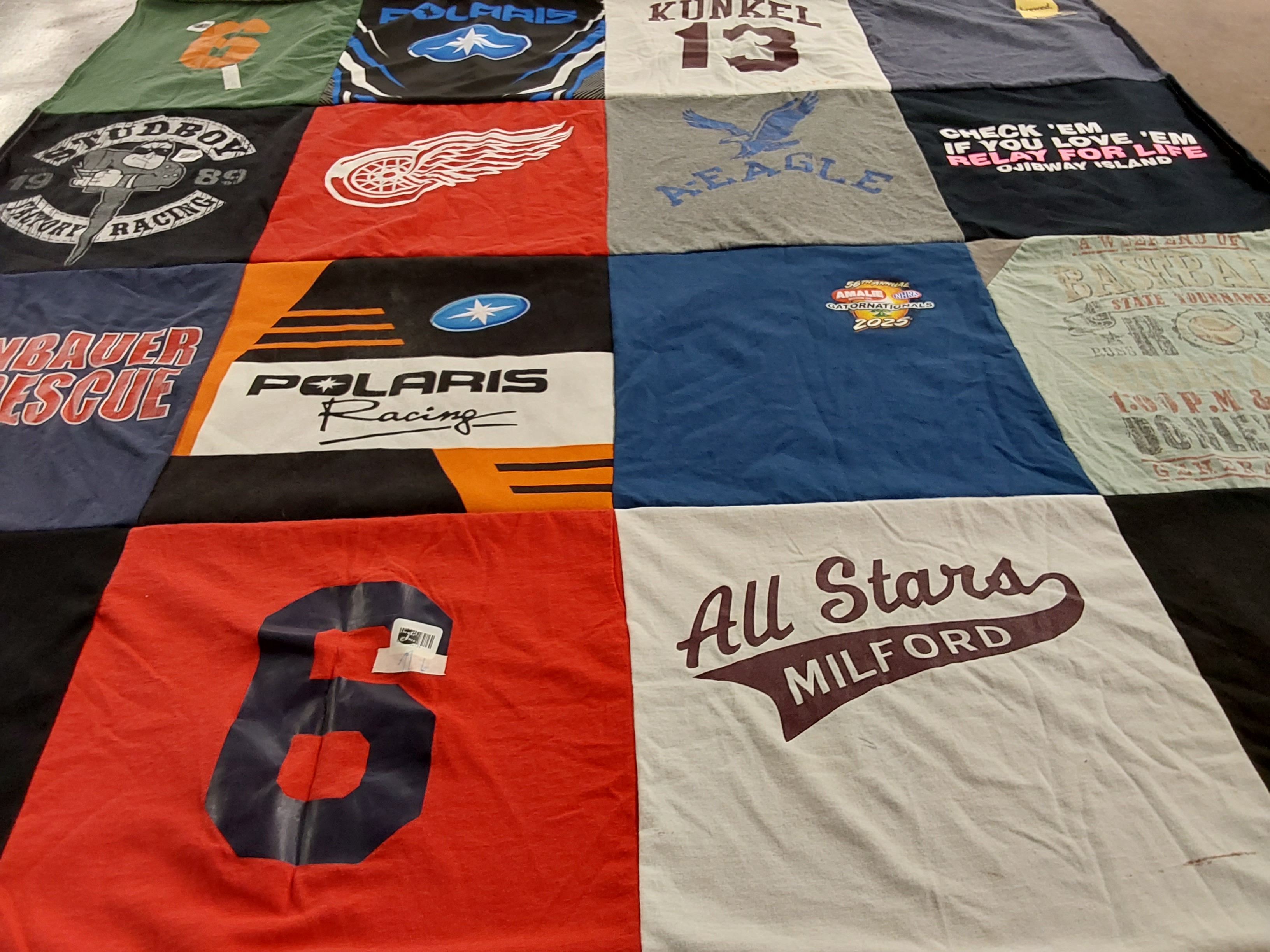 T-shirt quilt with racing, sports themes by Joan from MI