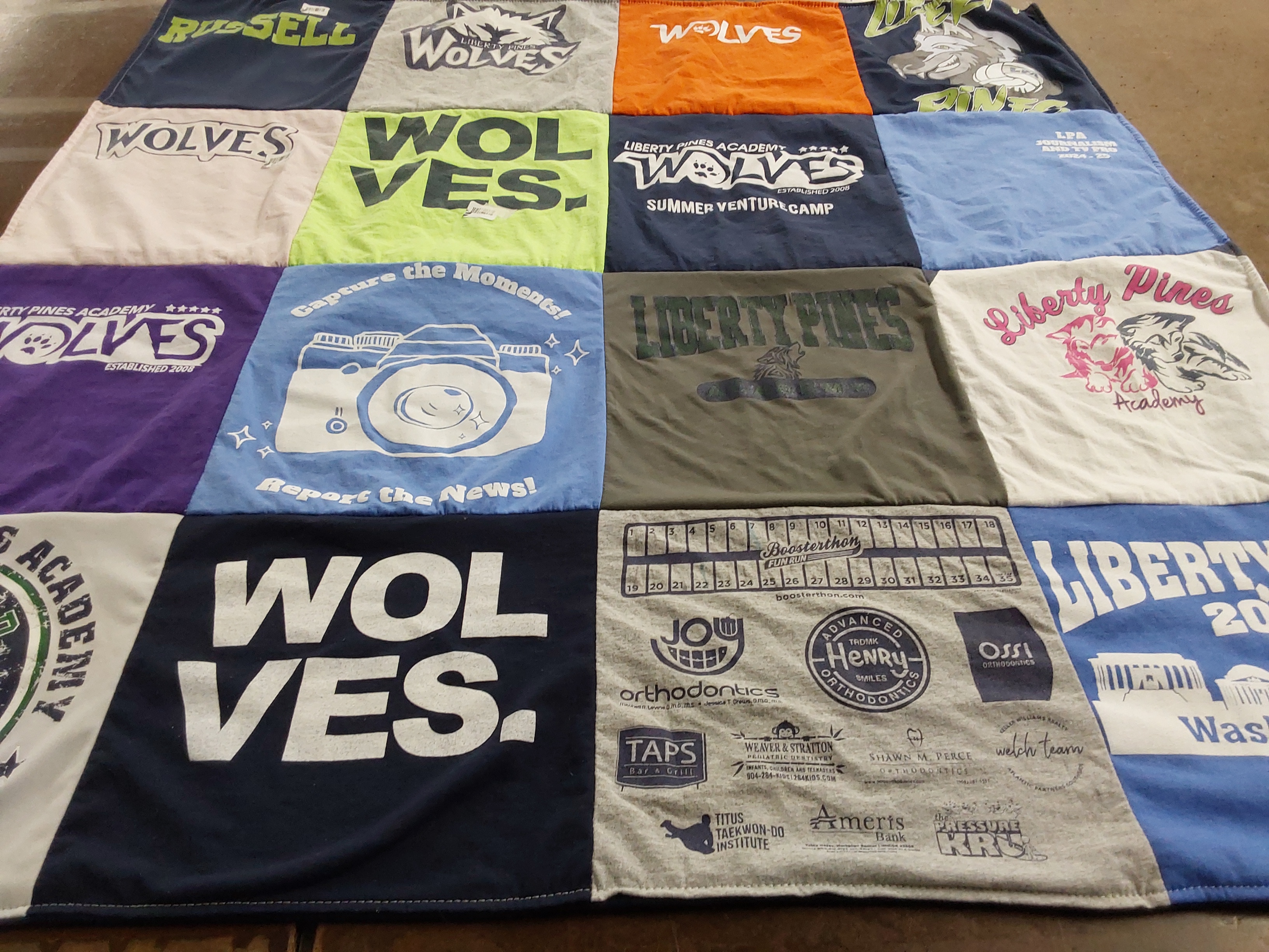 T-shirt quilt featuring liberty pines academy wolves by Amy from FL