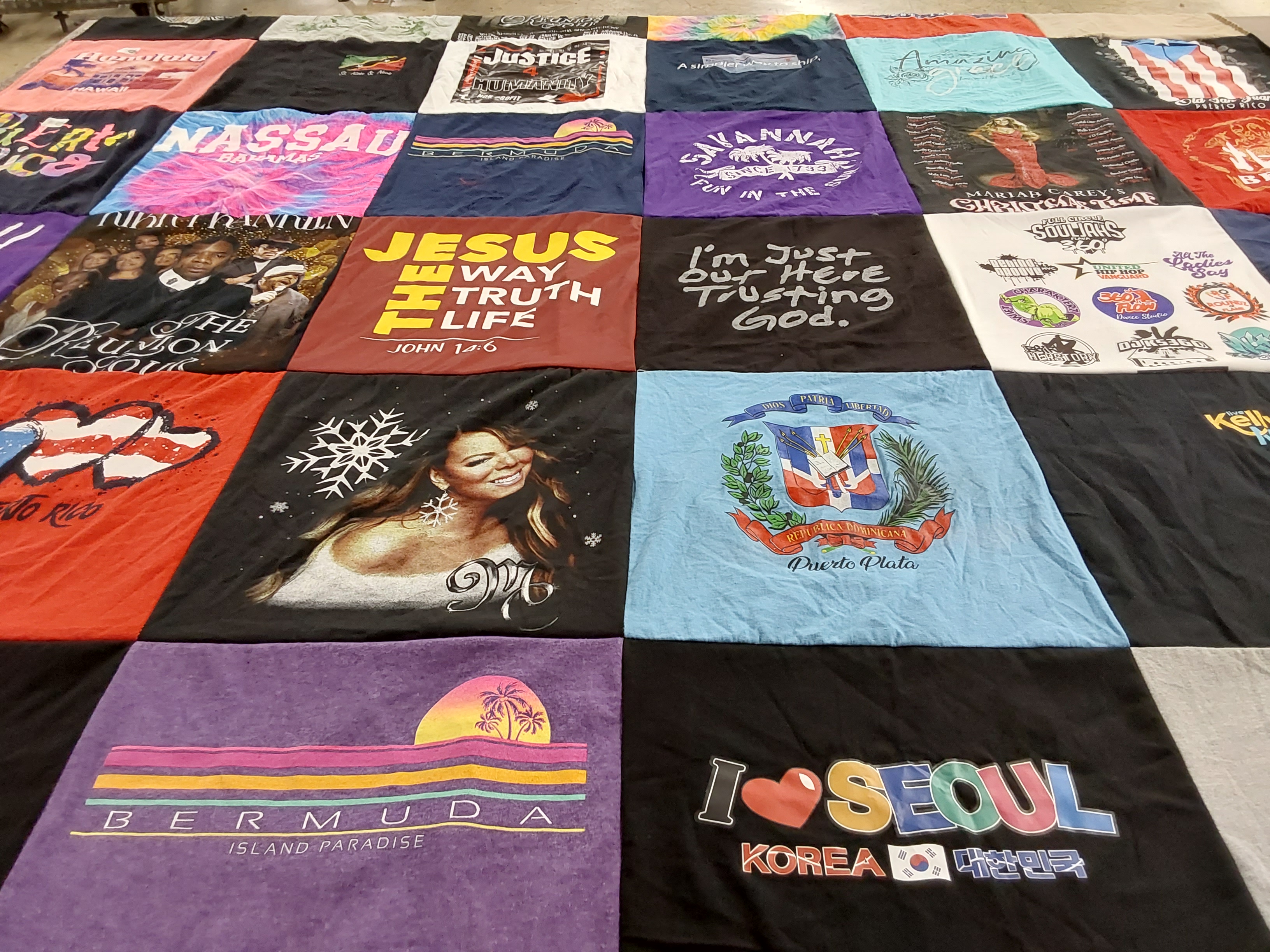 T-shirt quilt with travel, music themes by Doris from NY