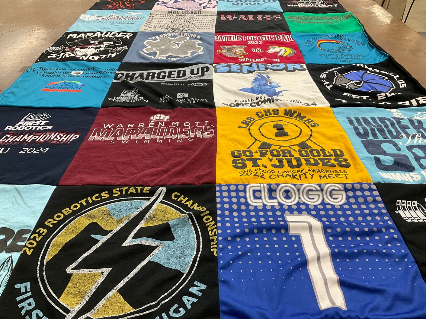 T-shirt quilt featuring marauders swimming by Anne from MI