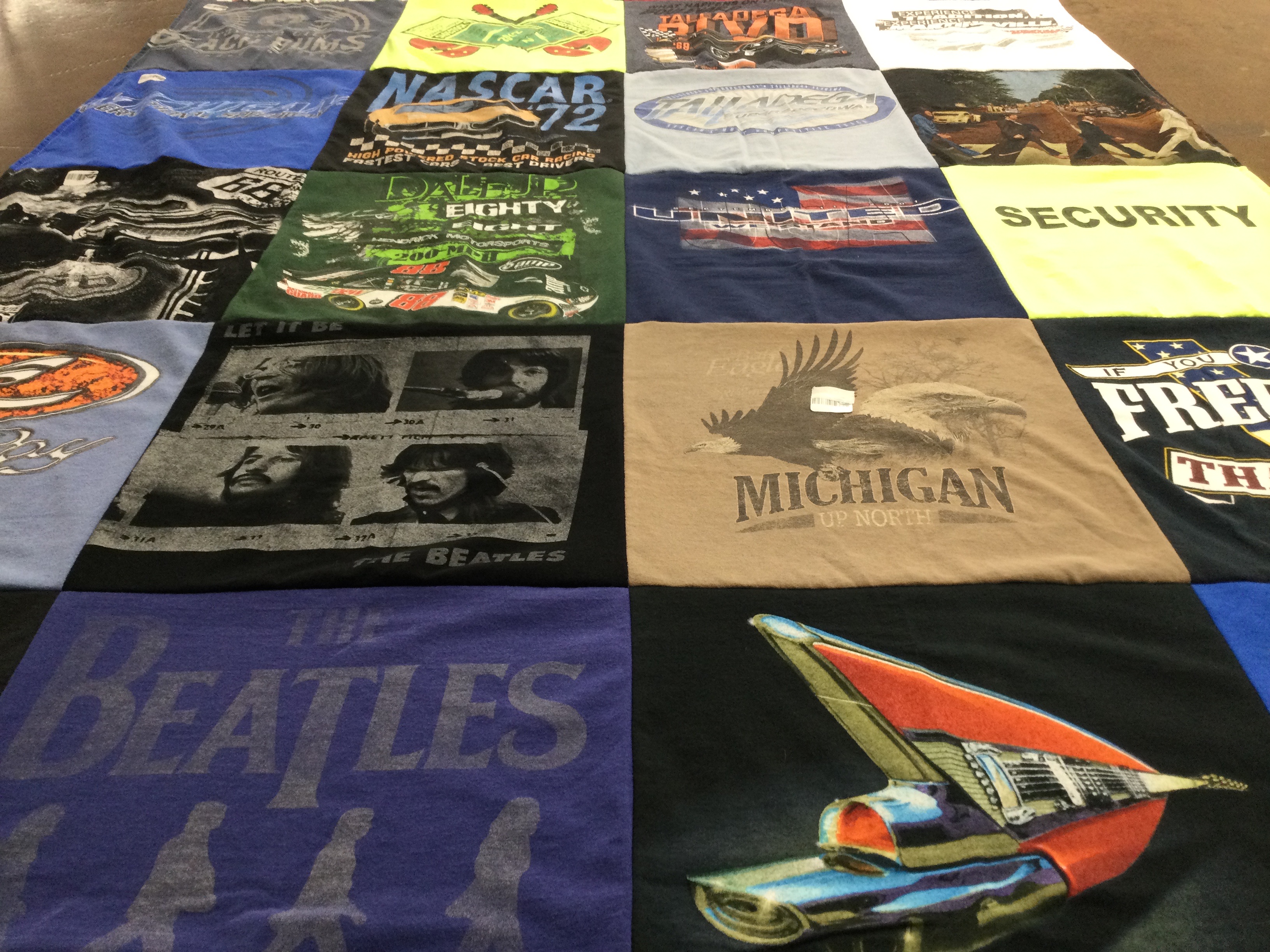 T-shirt quilt with cars, music themes by Amy from MI