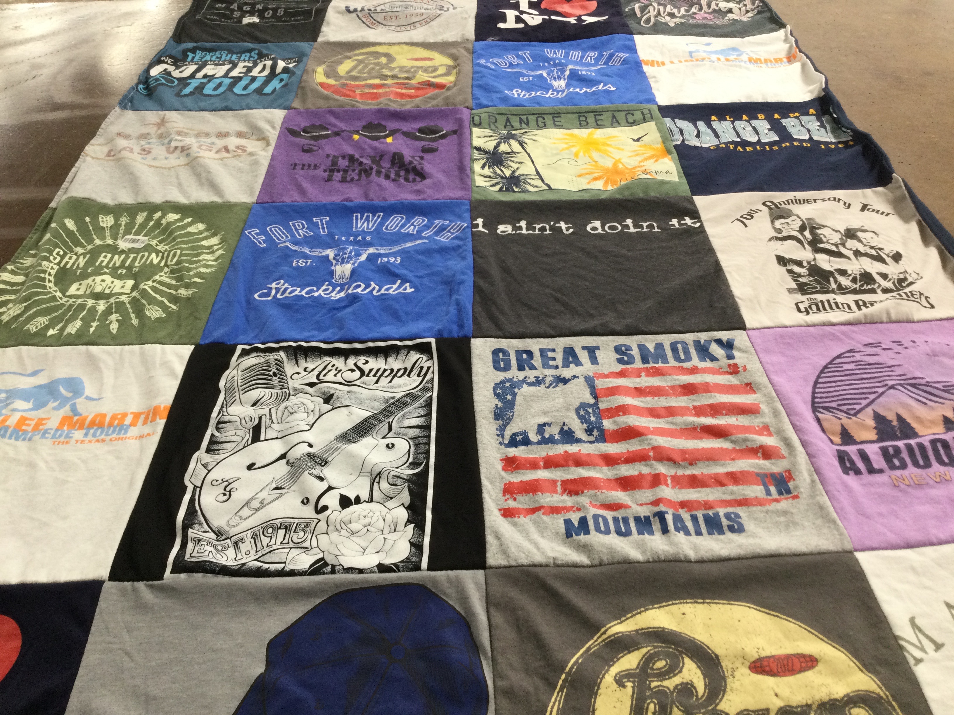 T-shirt quilt with music, travel themes by Ann-Marie from TX