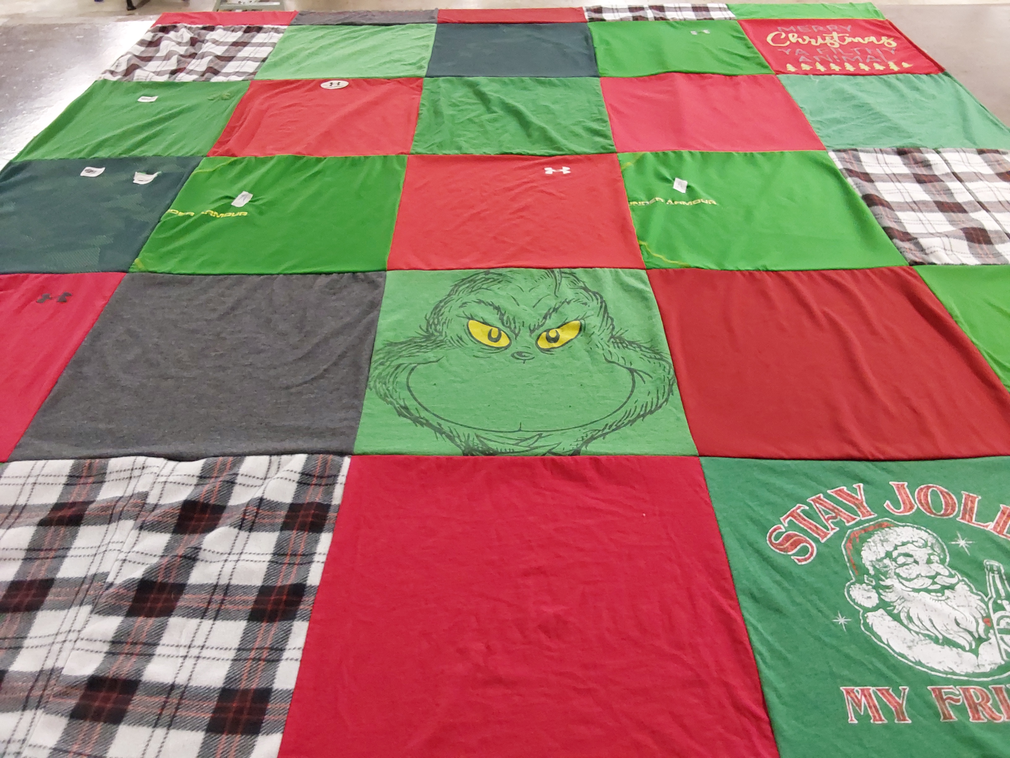 Custom Project Repat t-shirt quilt highlighting holiday, christmas themes.
