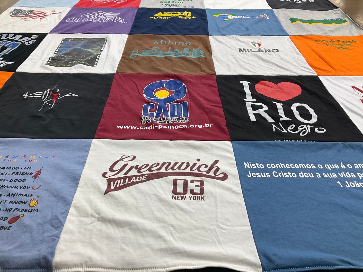 T-shirt quilt with travel, community service themes by Alana from LA