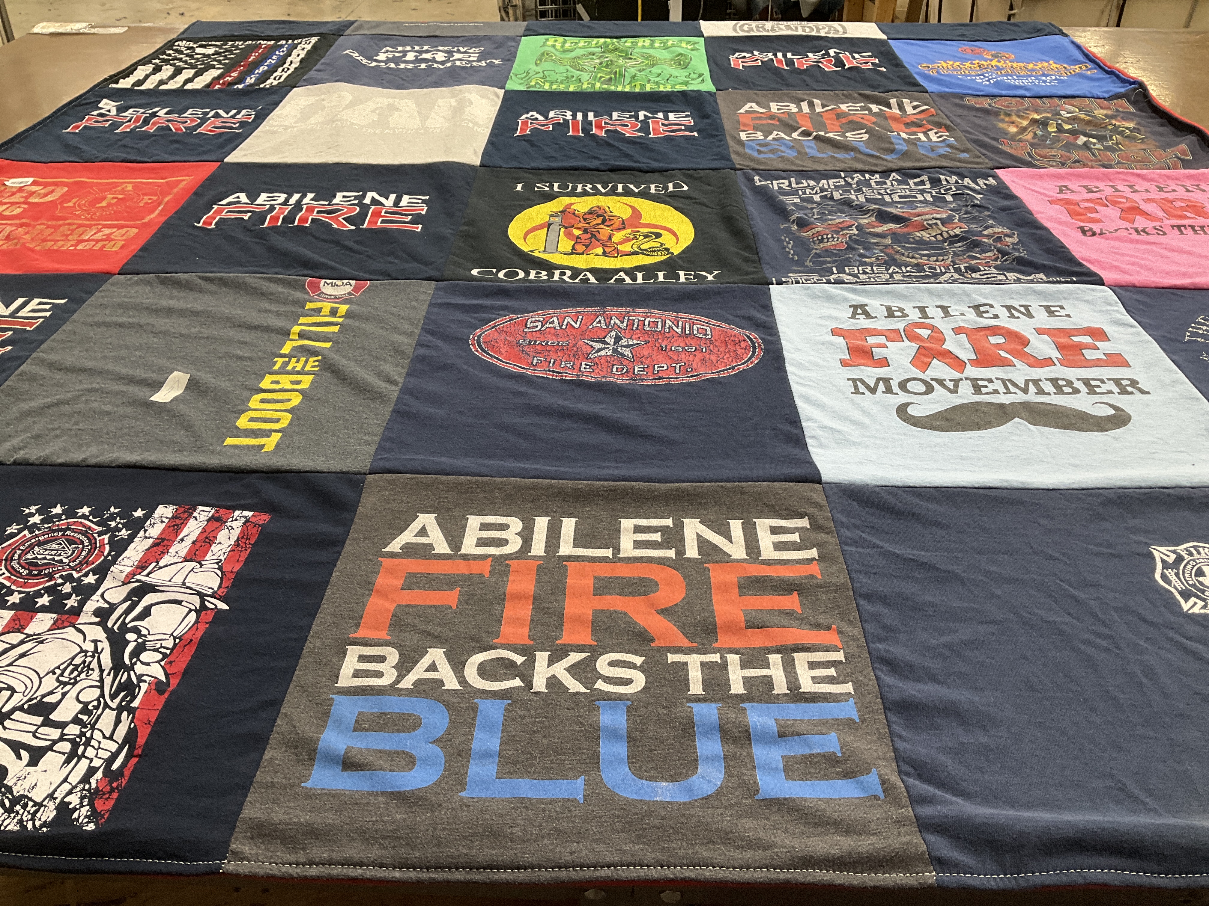 T-shirt quilt with firefighting, community service themes by Michelle from TX