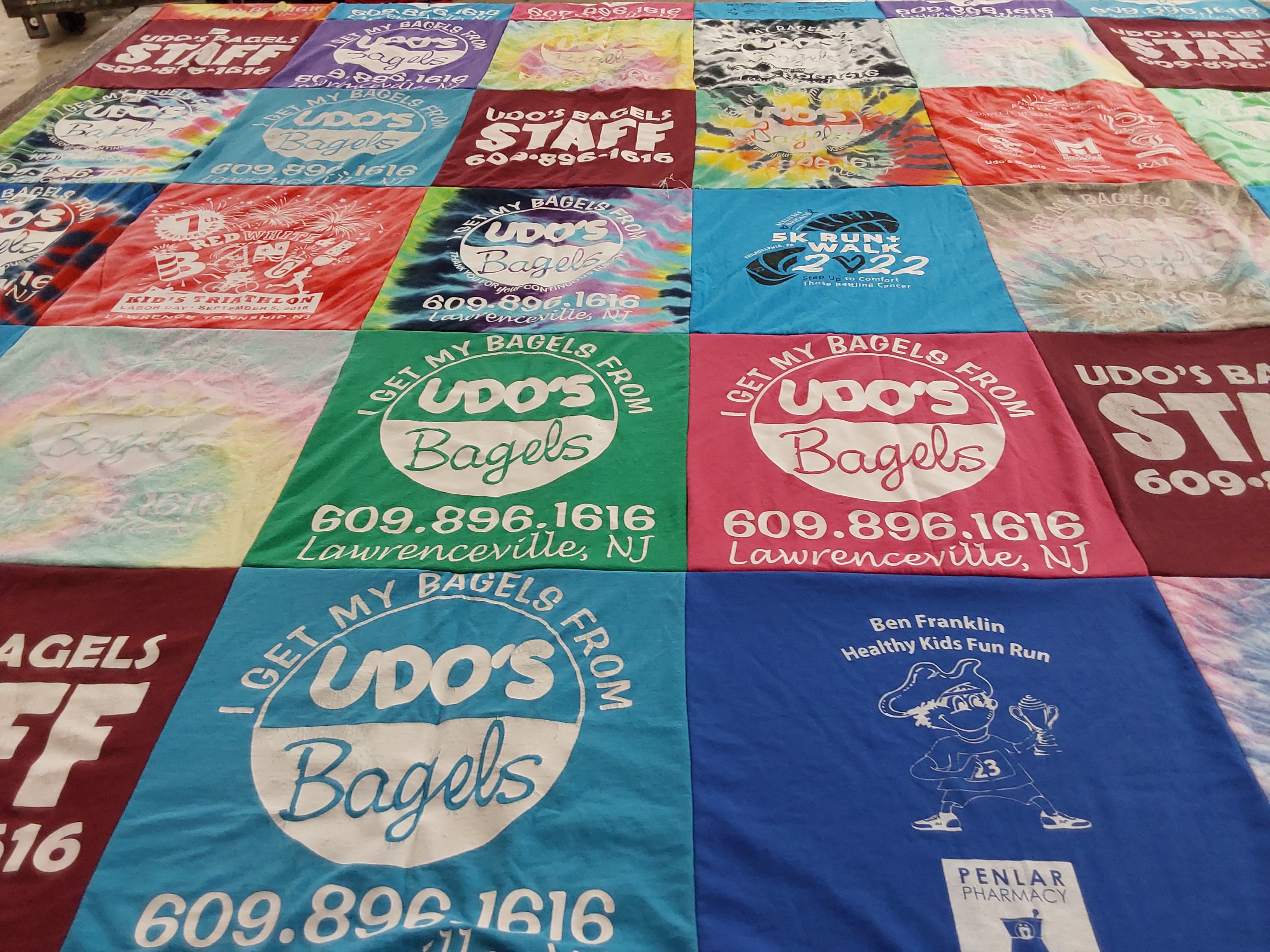 T-shirt quilt with bagels, running themes by Alexis from NJ