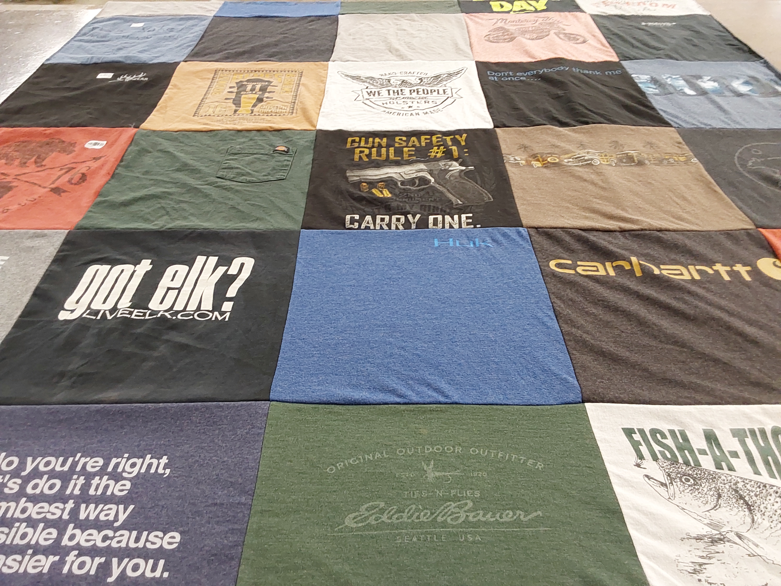 T-shirt quilt with hunting, fishing themes by Tabias from FL