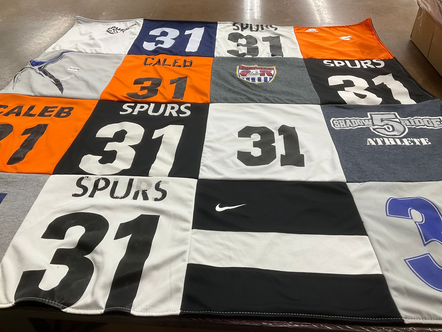 T-shirt quilt featuring spurs by Caleb from TX