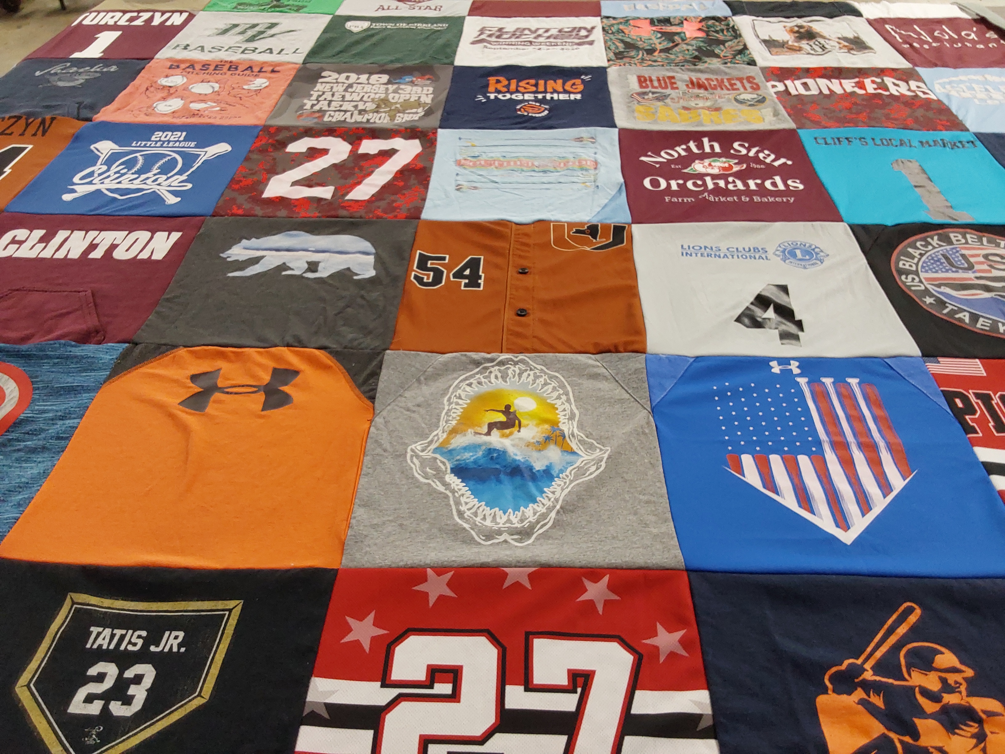 T-shirt quilt featuring blue jackets, pioneers by Brandi from NY