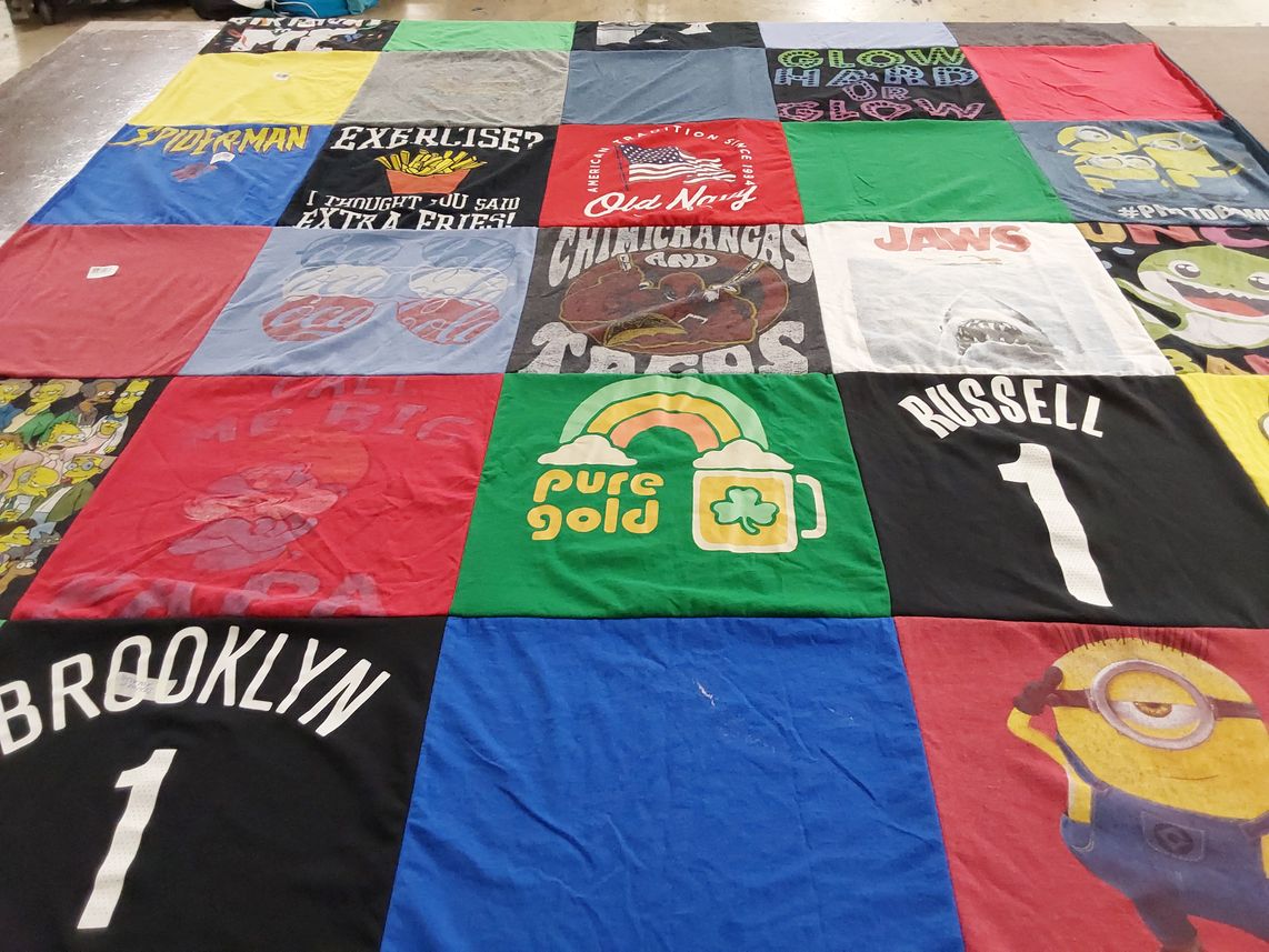 T-shirt quilt with movies, cartoons themes by Bernadette from NY