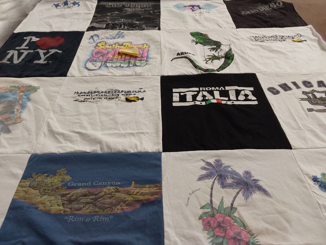 T-shirt quilt with travel, tourism themes by Iluminada from PA