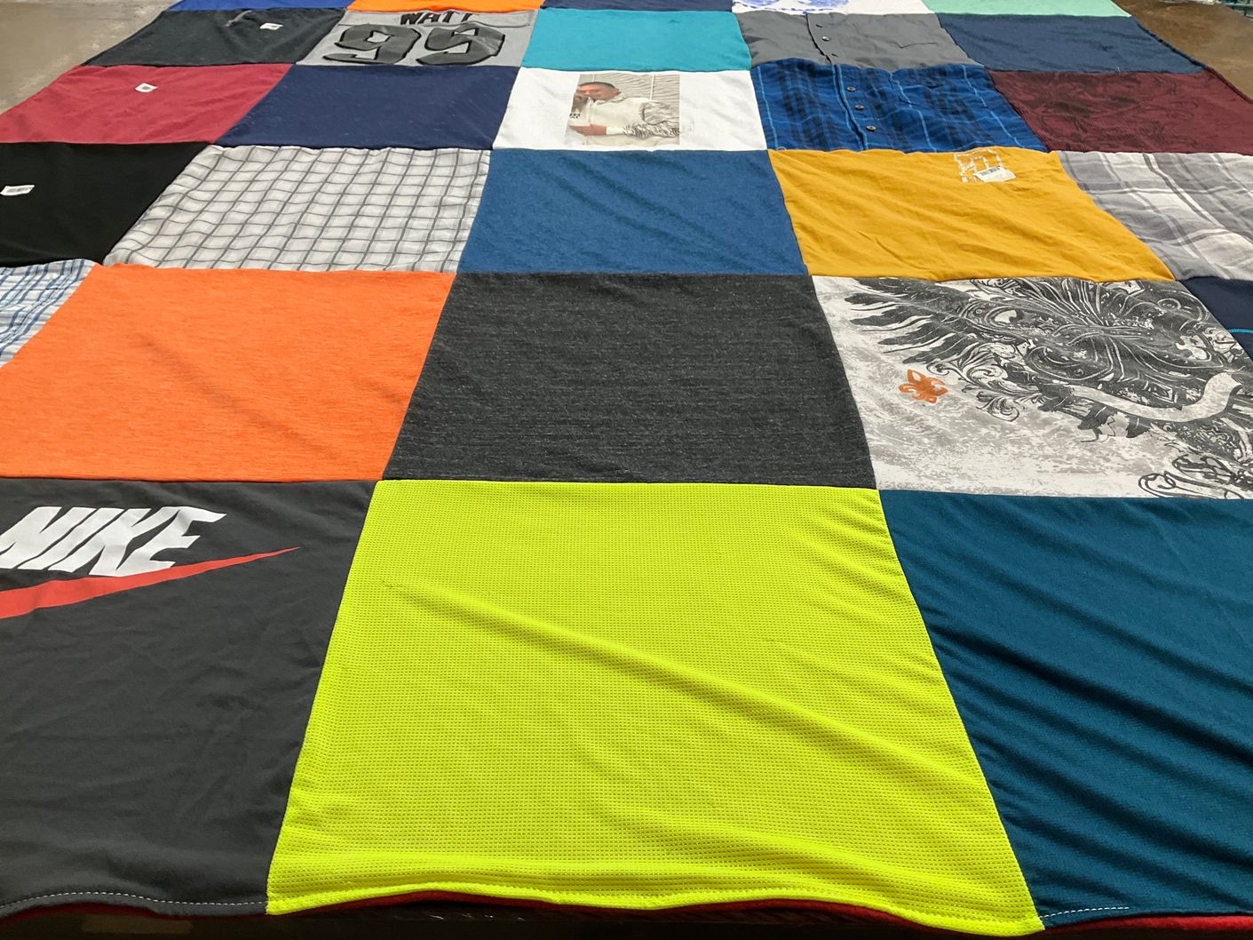 T-shirt quilt with sports, fashion themes by Ashley from TX