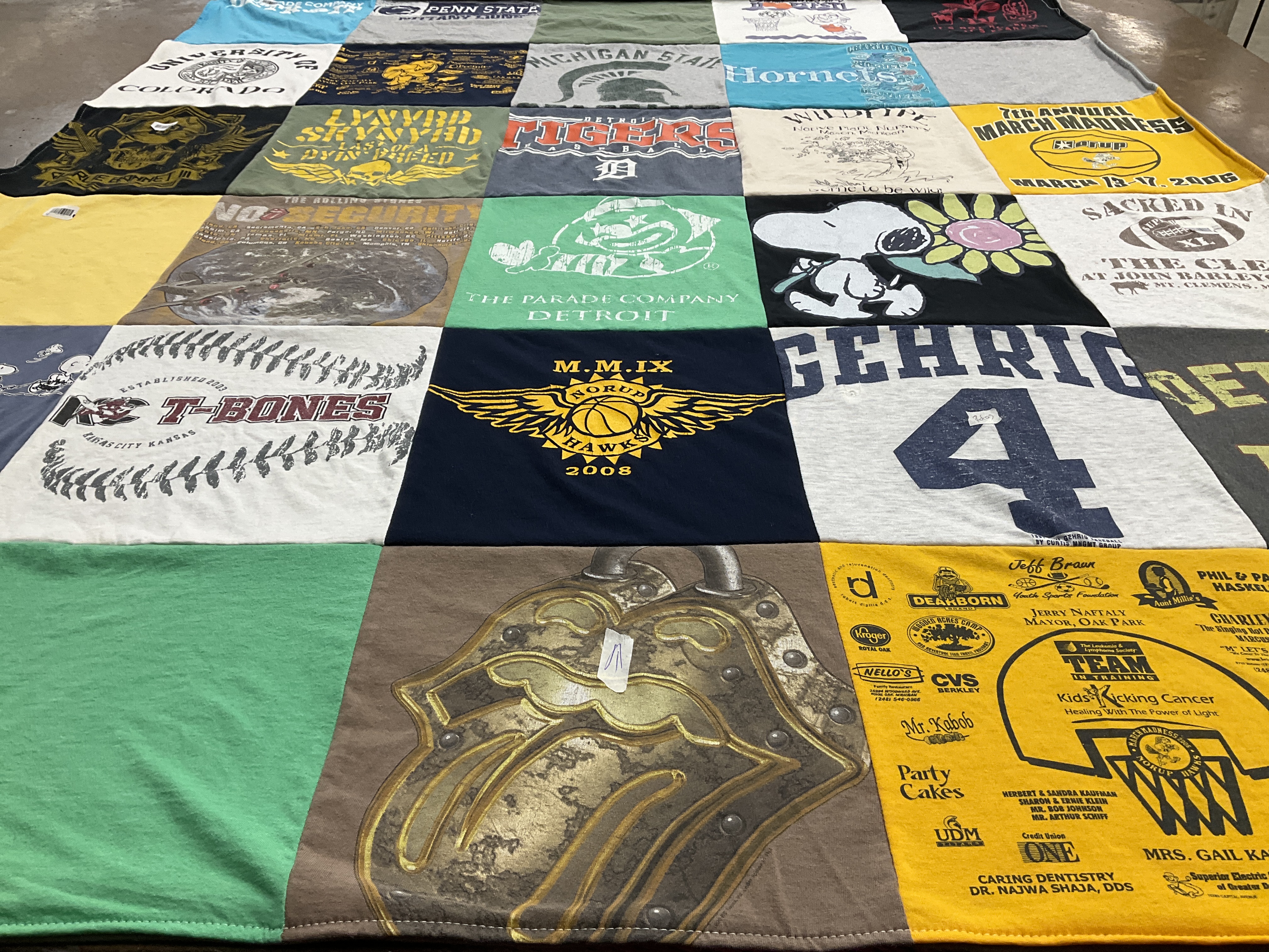 Custom Project Repat t-shirt quilt featuring shirts from penn state university.