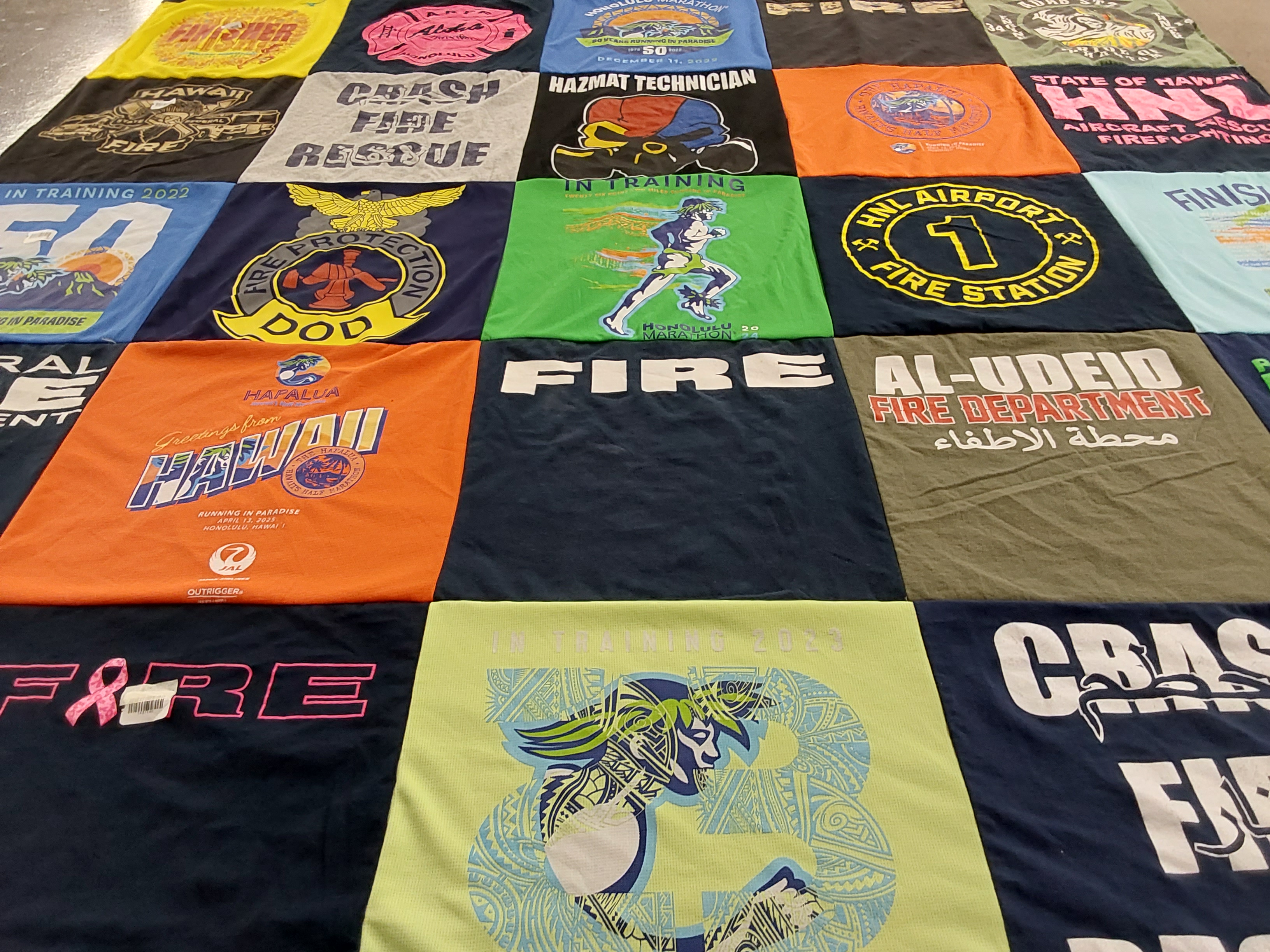 T-shirt quilt with firefighting, hazmat training themes by Cedric from HI