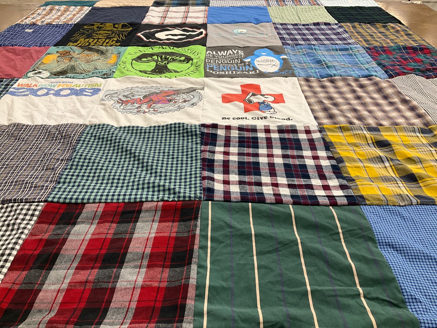 T-shirt quilt with animal conservation, autism awareness themes by Thomas from FL