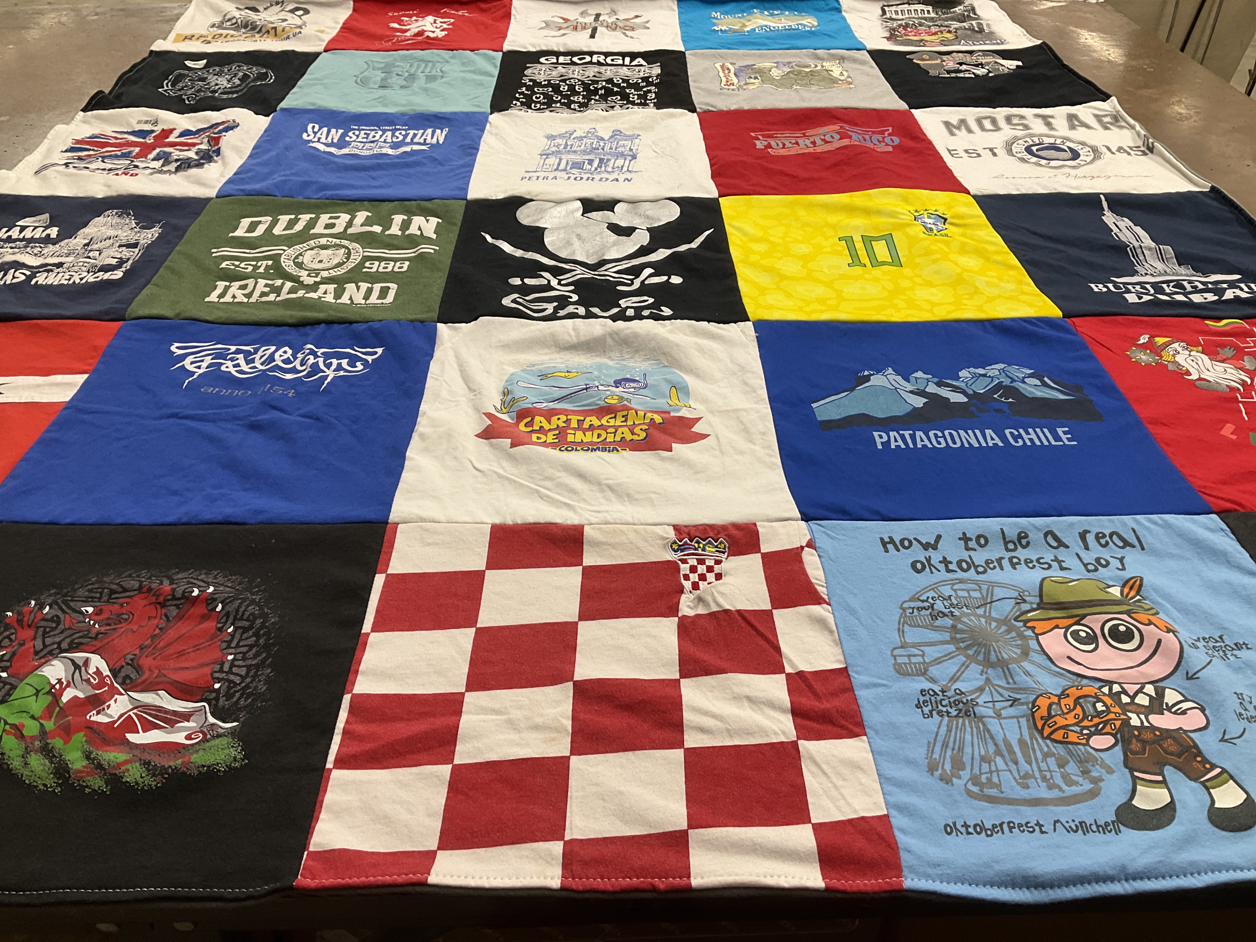 T-shirt quilt with traveling, cultural events themes by Caitlyn from SC