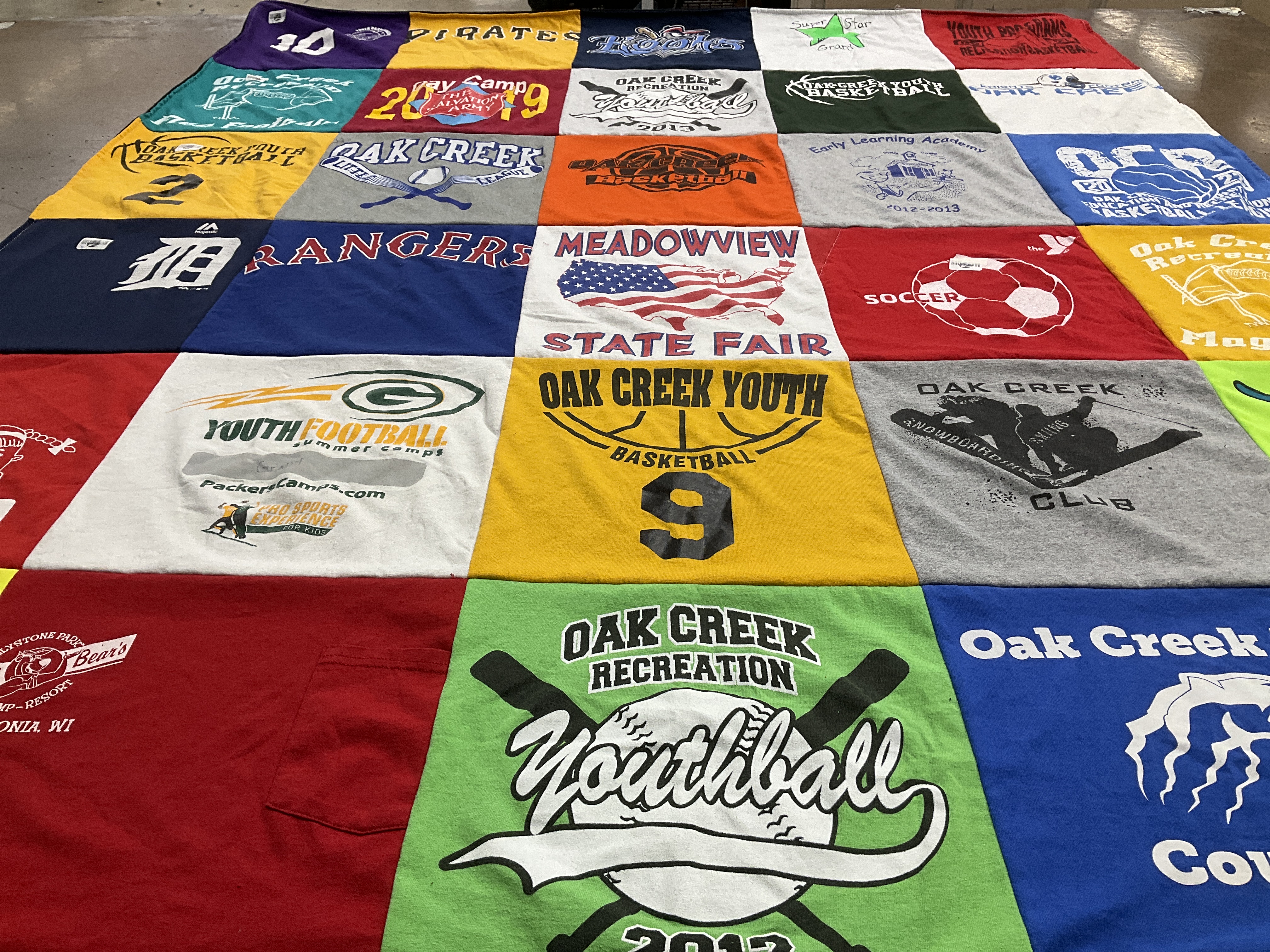 T-shirt quilt featuring oak creek youth basketball, oak creek youth soccer by Christine from WI