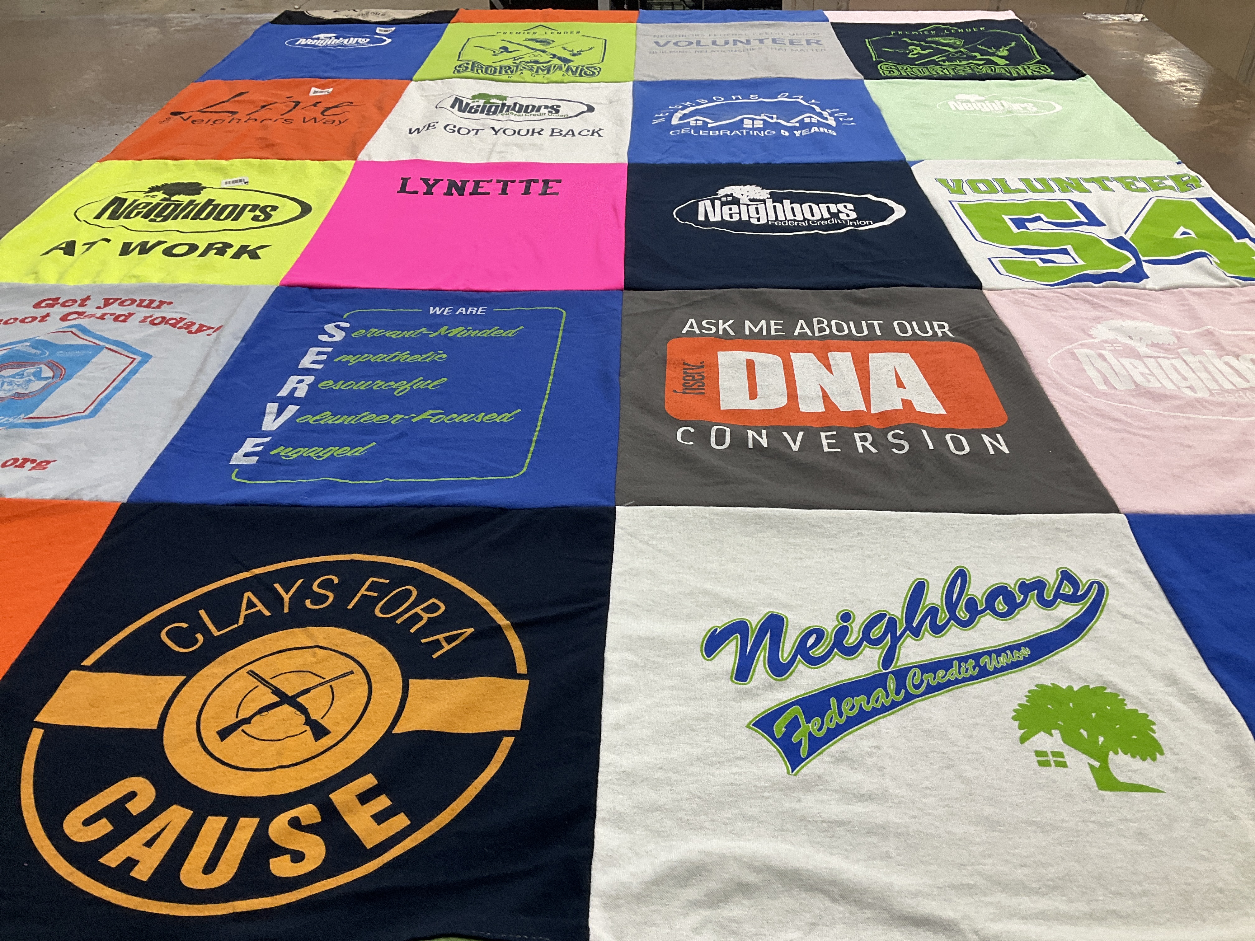 T-shirt quilt with volunteering, community service themes by Lynette from LA