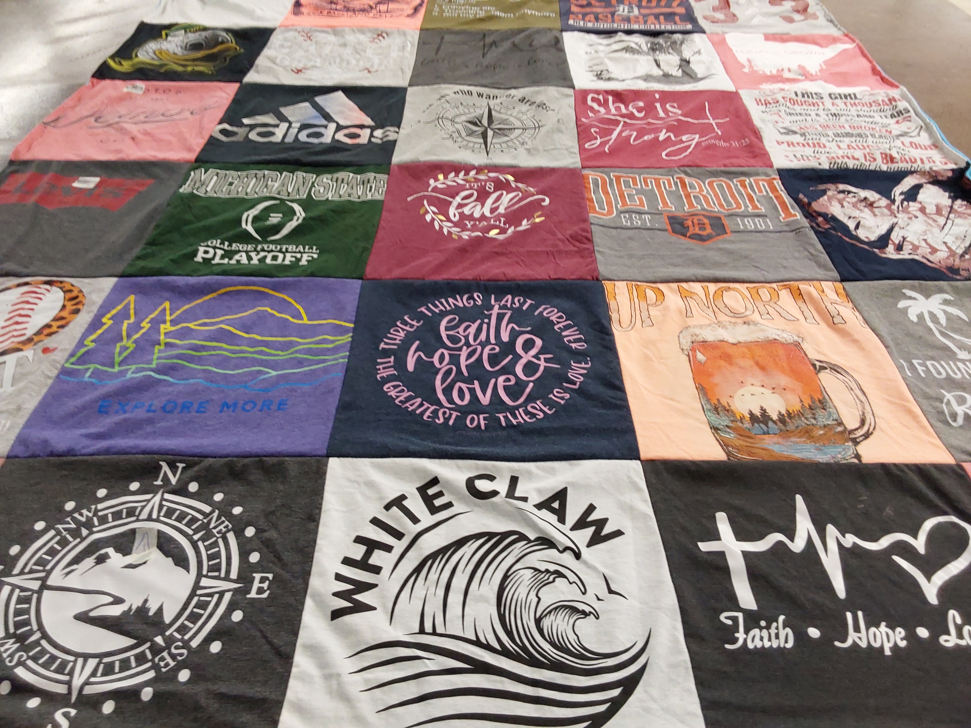 Custom Project Repat t-shirt quilt featuring shirts from michigan state university.