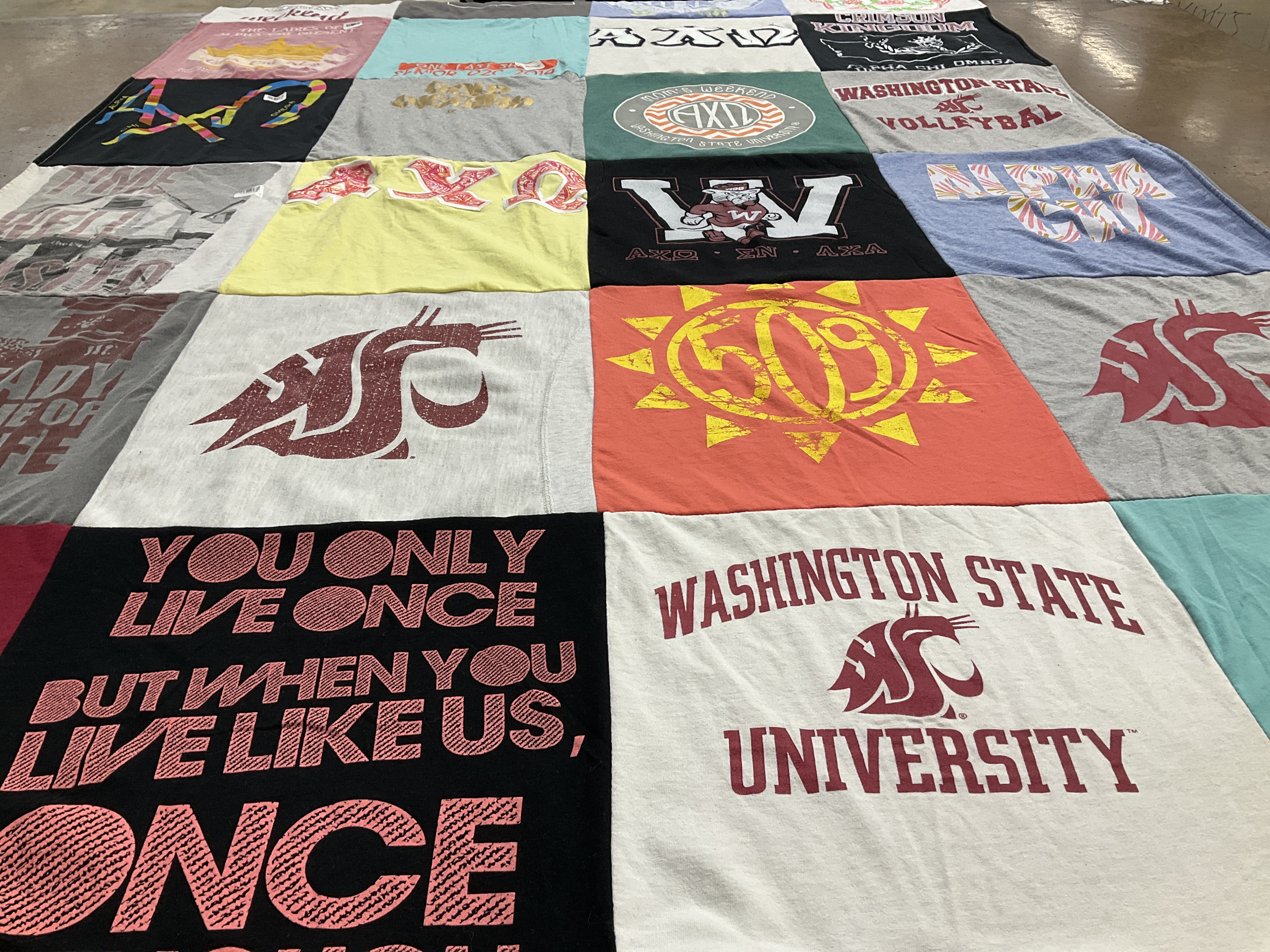 Custom Project Repat t-shirt quilt featuring shirts from washington state university.
